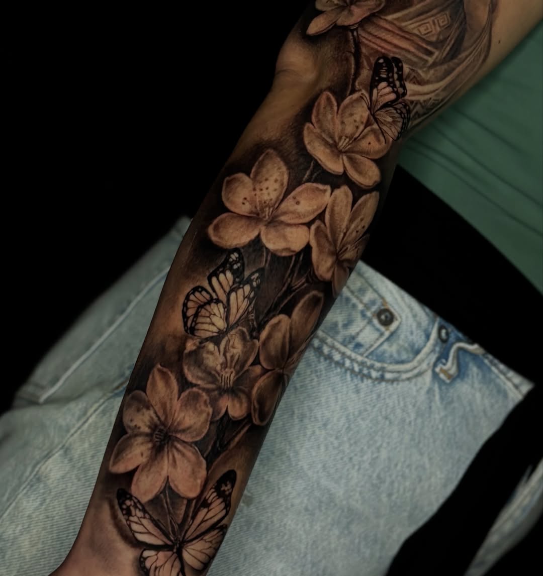 Cherry blossoms and butterflies realism tattoo on the forearm by @_frankyvee