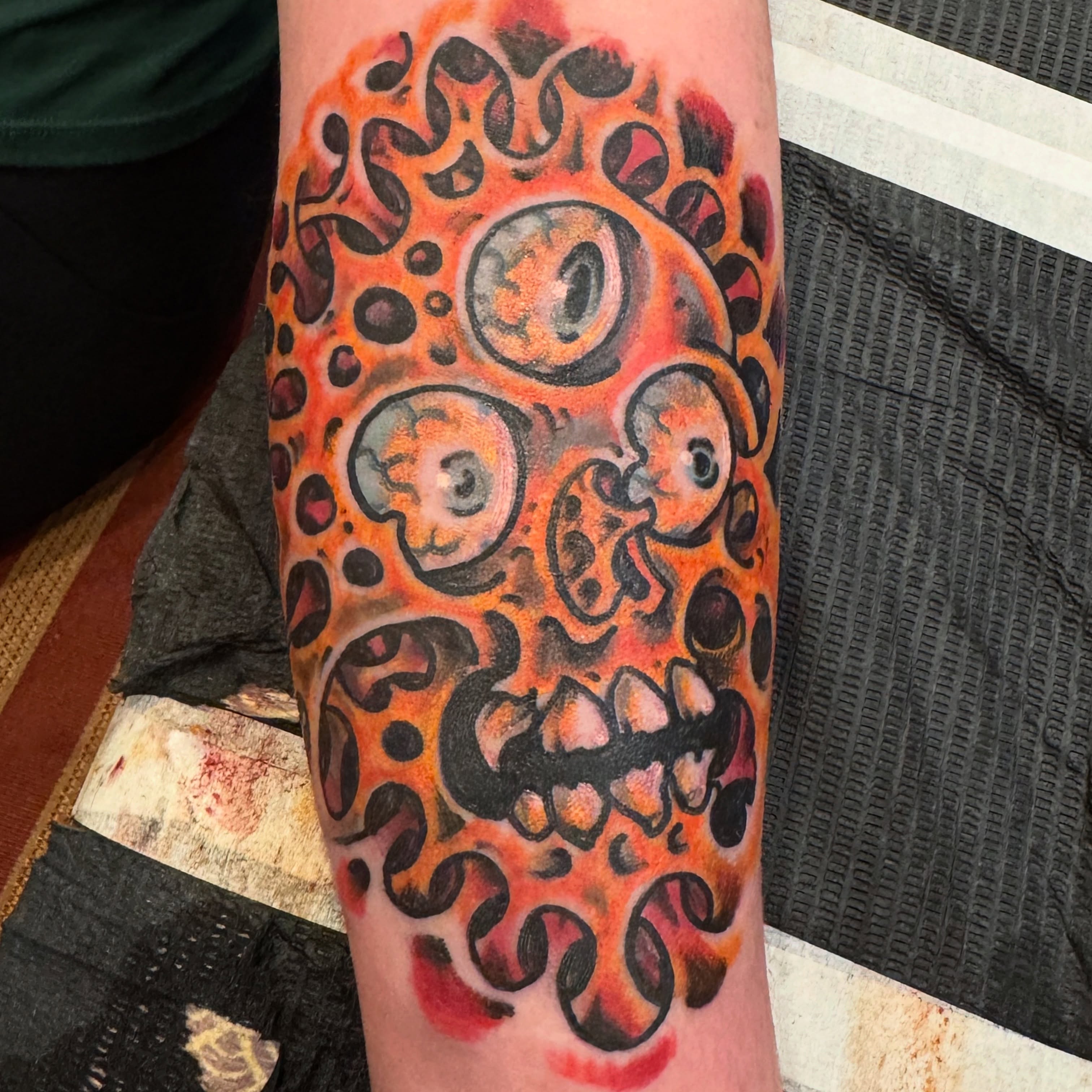 Abstract skull trash polka tattoo on the forearm by Brian DiCola Tattooer