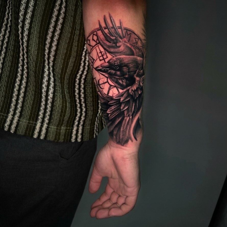 Bird realism tattoo on the forearm by Blue Horseshoe Tattoo & Body Piercing