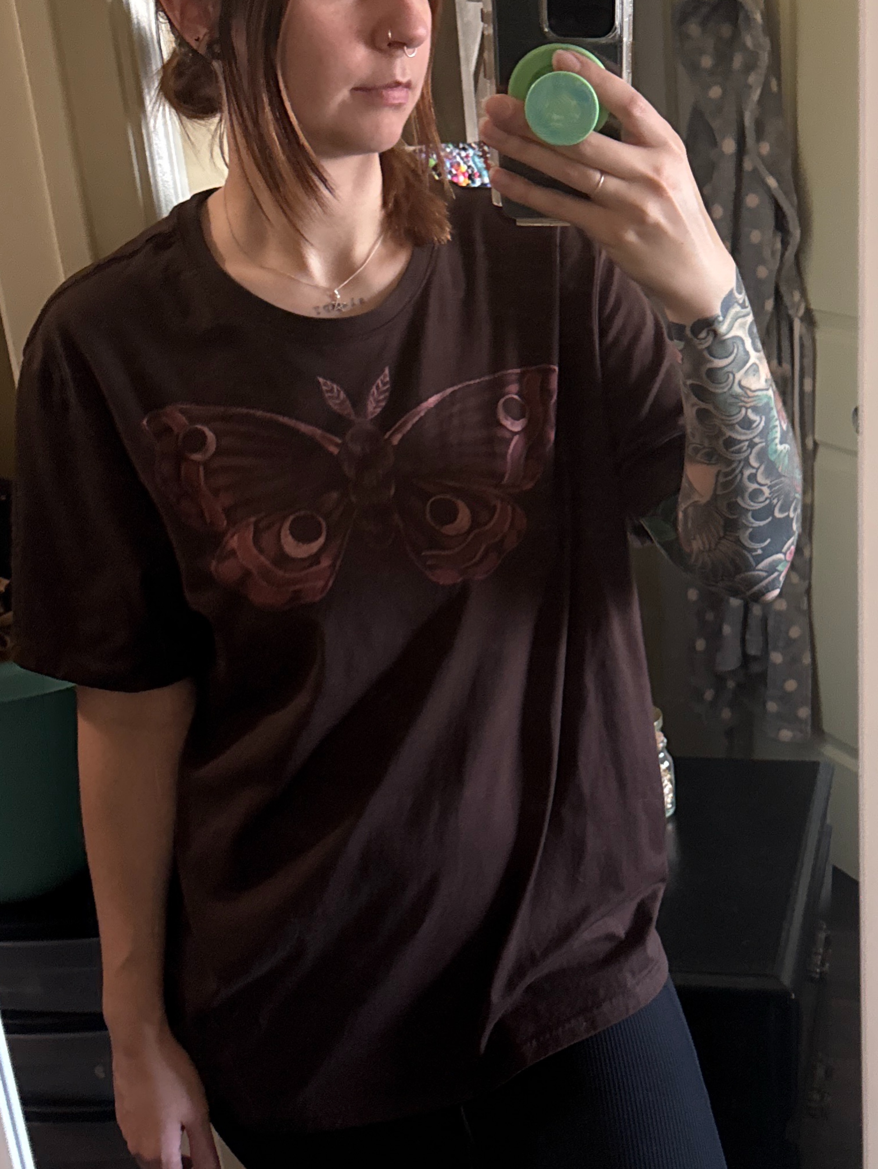 Butterfly American traditional tattoo on the upper arm by Camryn Justice