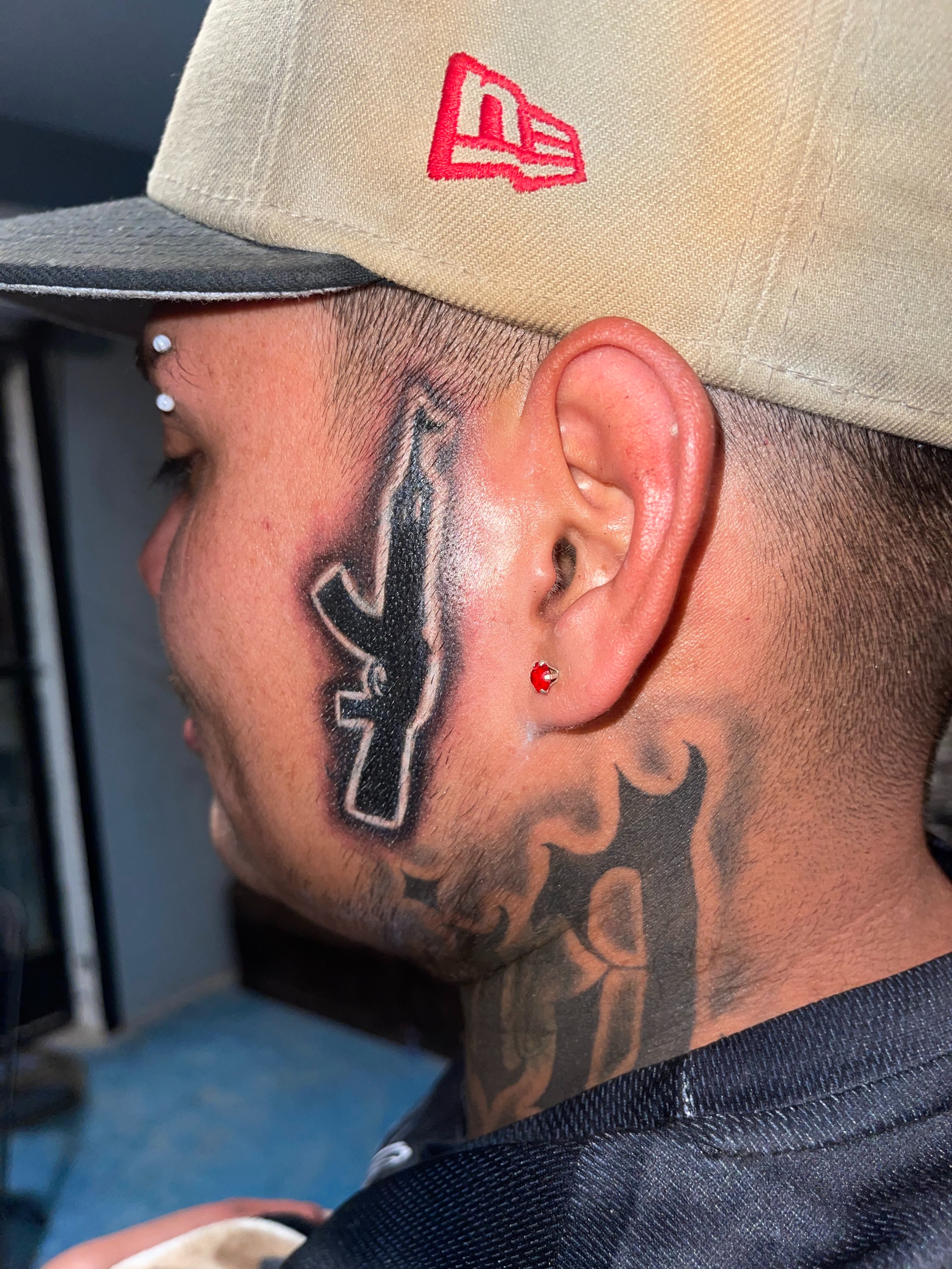 Flame black and grey tattoo on the head by Tu SanchoTattoos