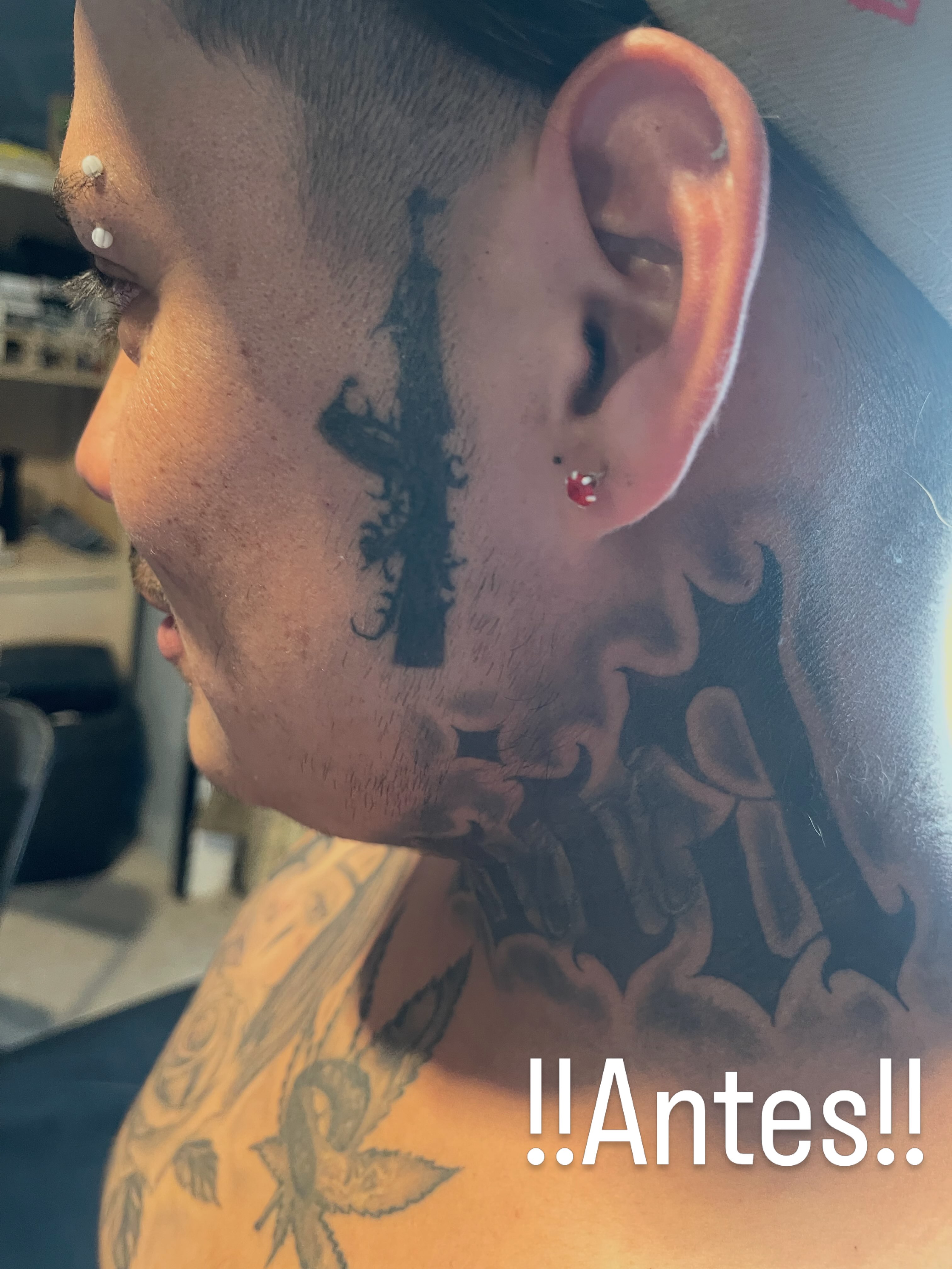 Gun silhouette black and grey tattoo on the neck by Tu SanchoTattoos