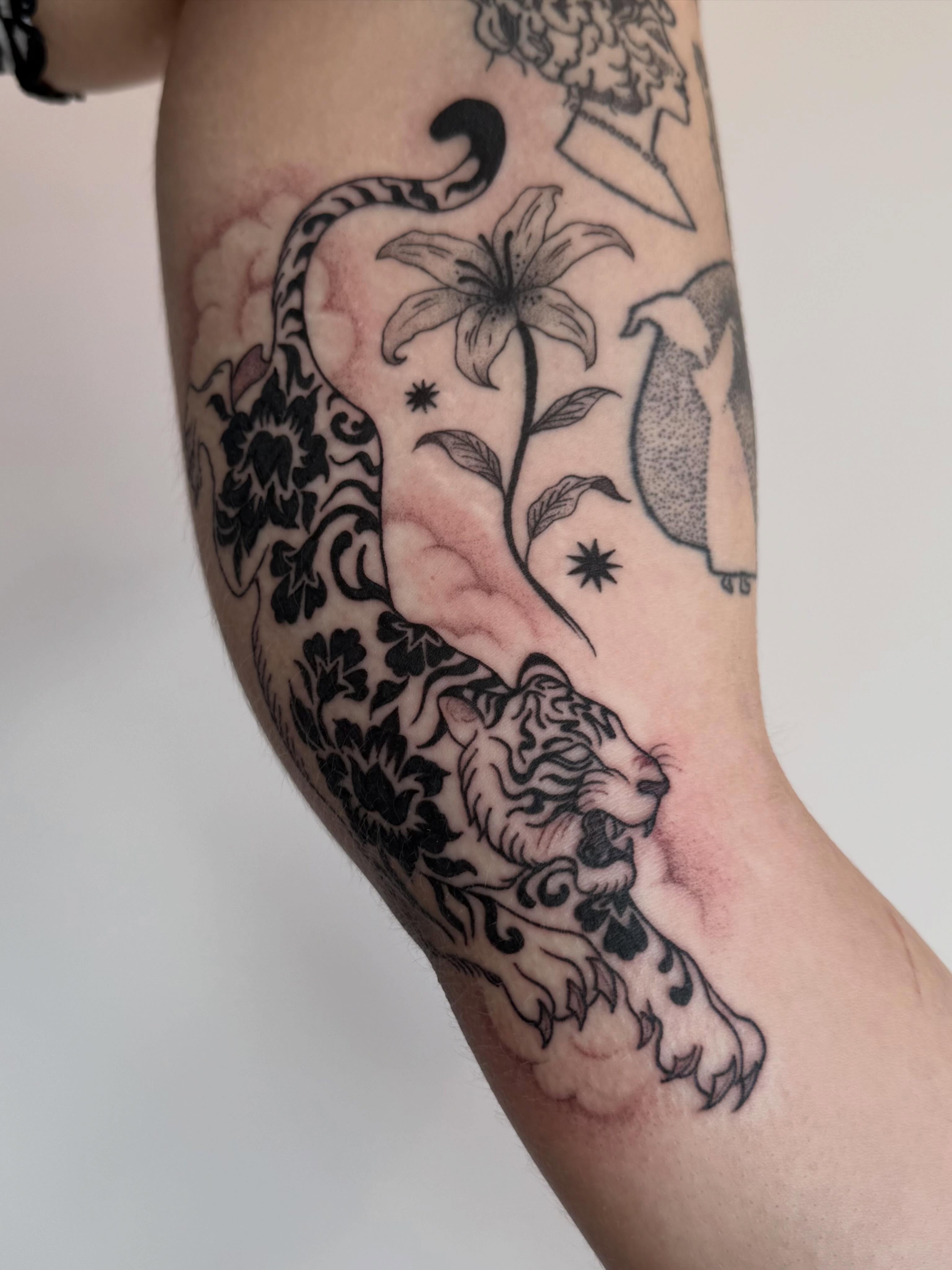Lion and lily black and grey tattoo on the forearm by Sierra Hiddleson- Phoenix Arizona Tattoo