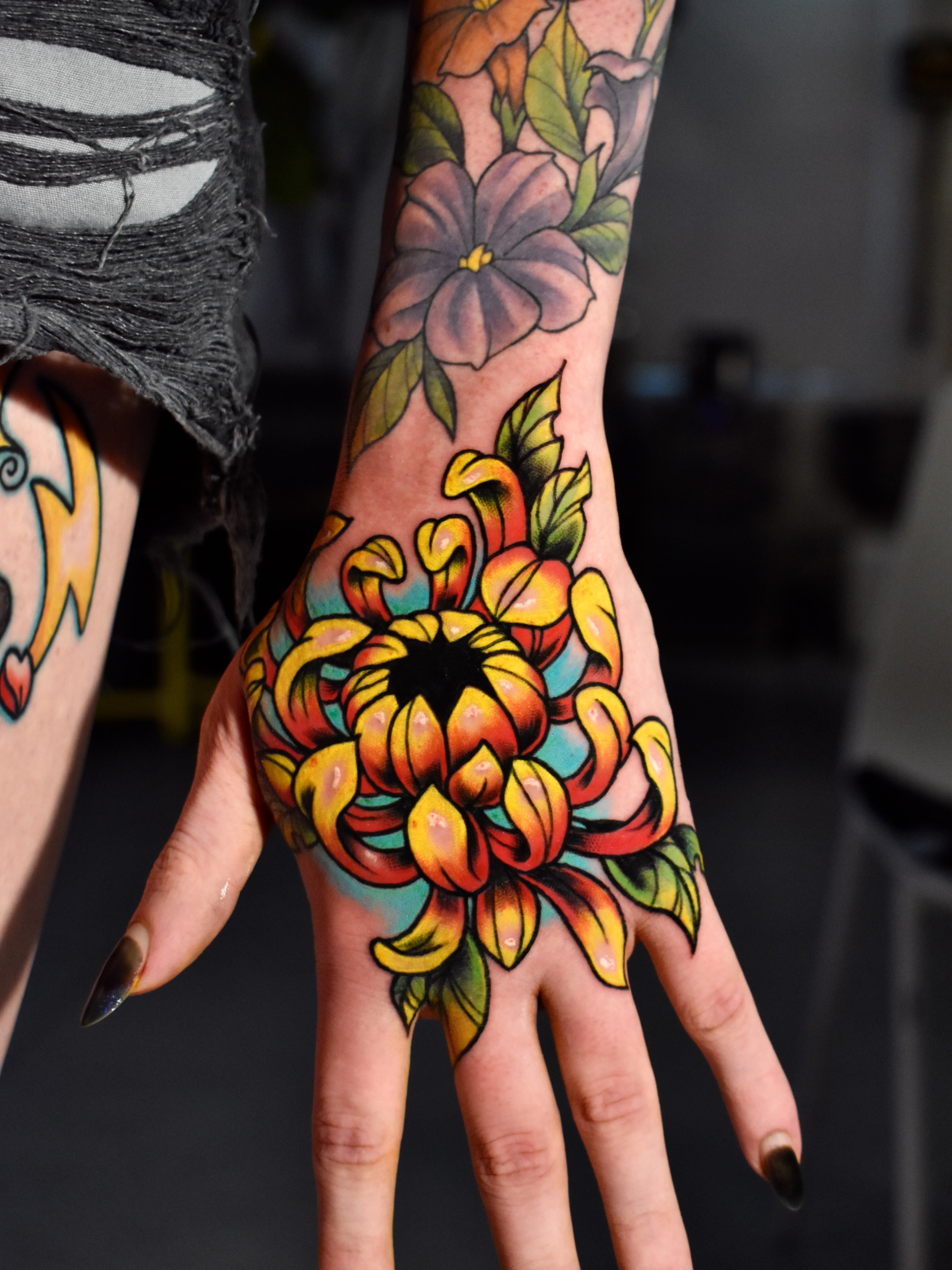 Floral arrangement American traditional tattoo on the hand by Mackz