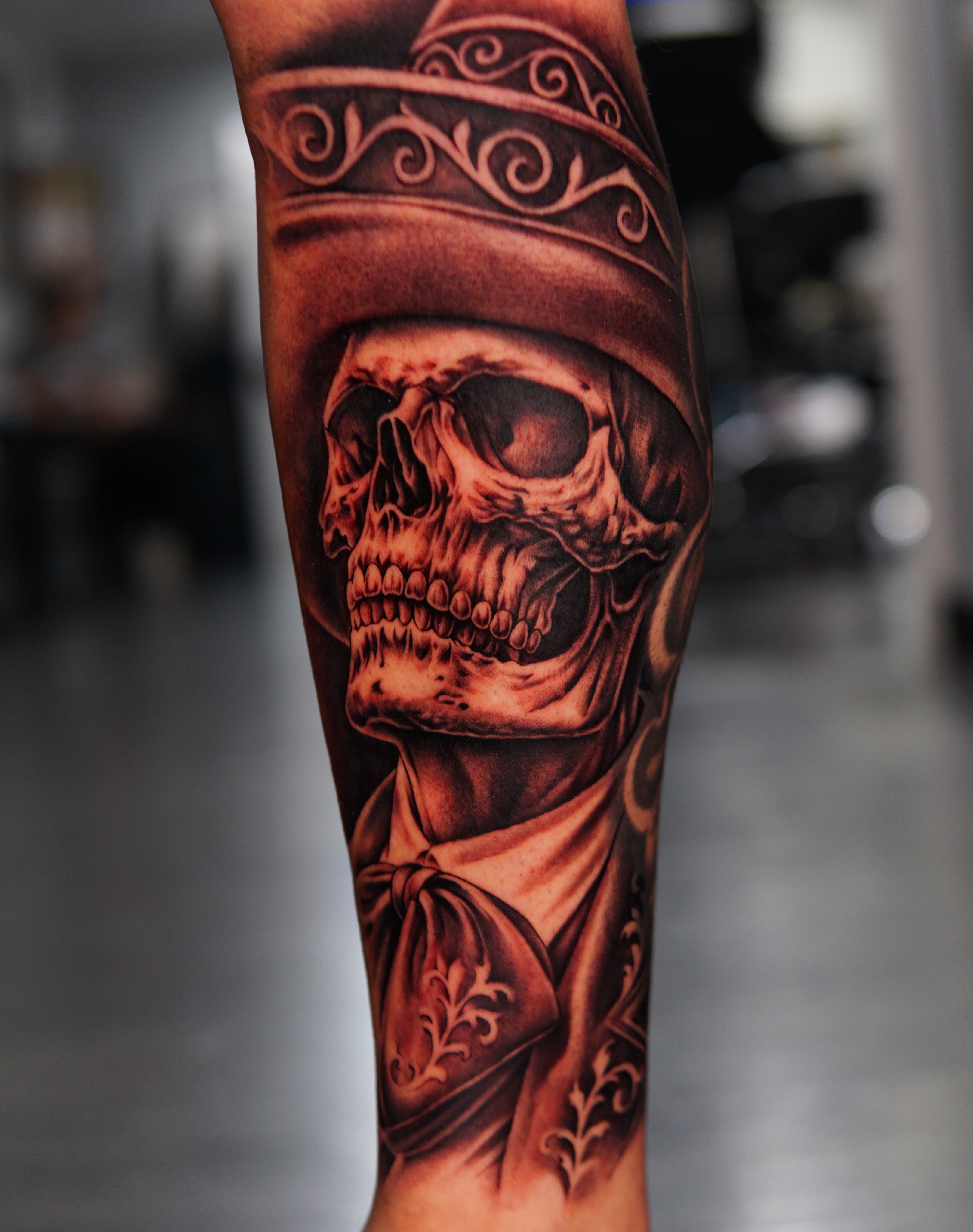 Skull wearing hat realism tattoo on the forearm by Atlanta Tattoo Artist, Atlanta, Georgia