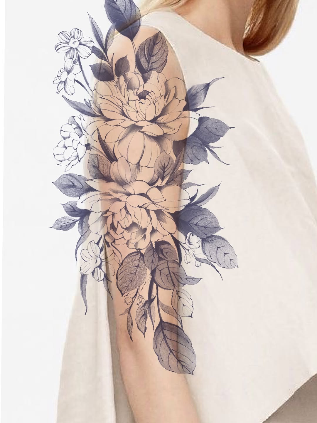 Floral arrangement sketch tattoo on the upper arm by Jinz