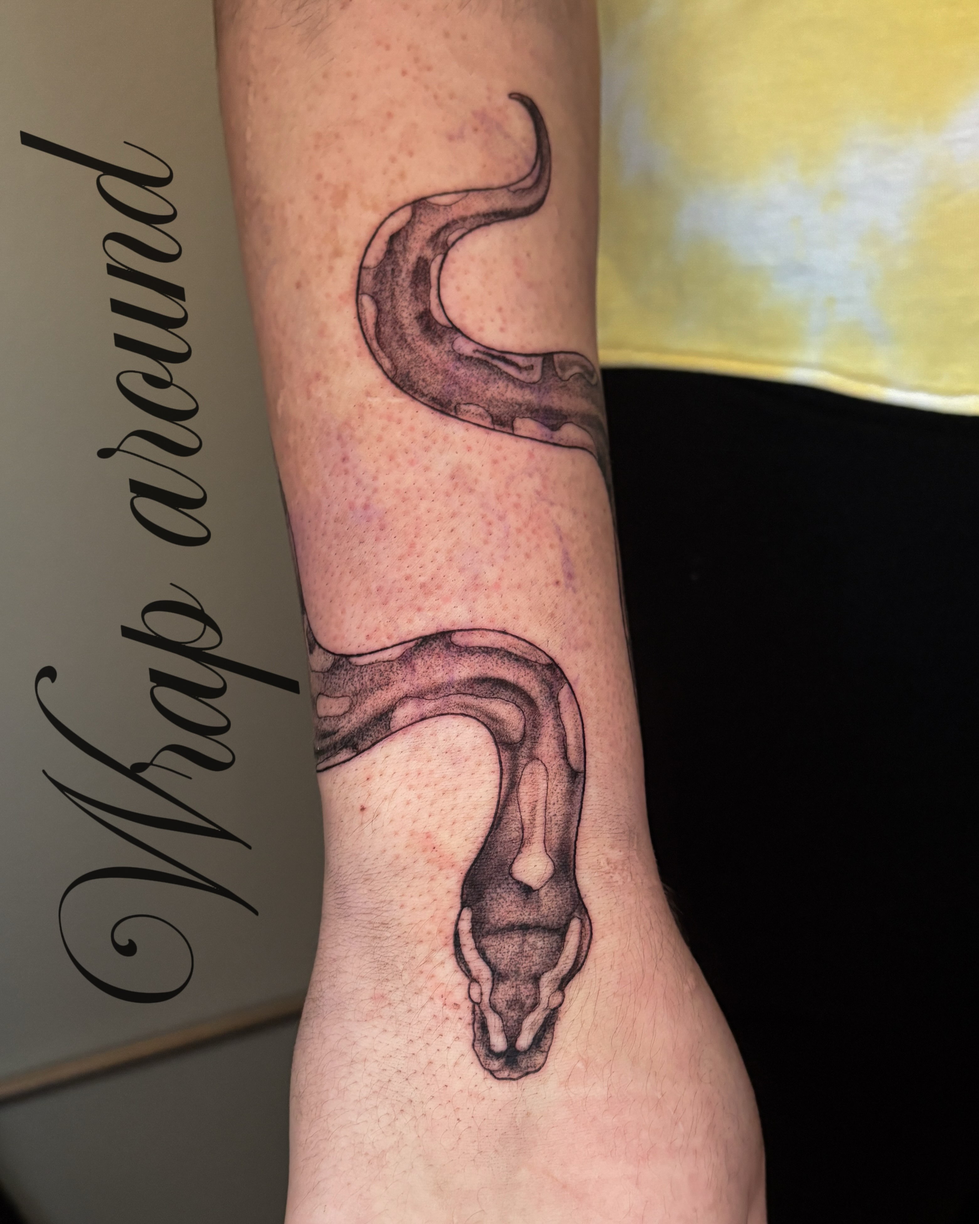 Snake black and grey tattoo on the forearm by Autumn