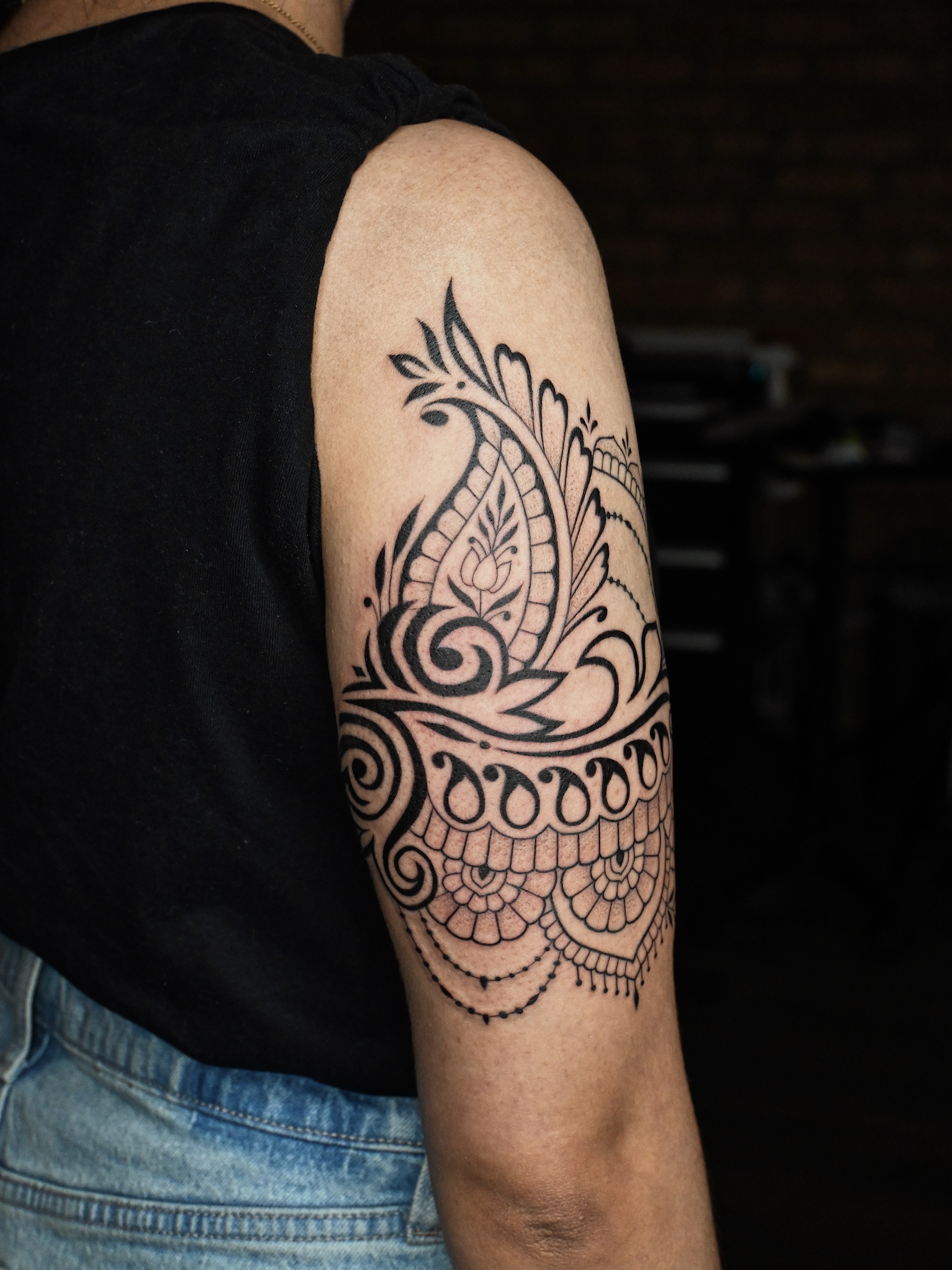 Floral pattern black and grey tattoo on the forearm by Sabreena Haque