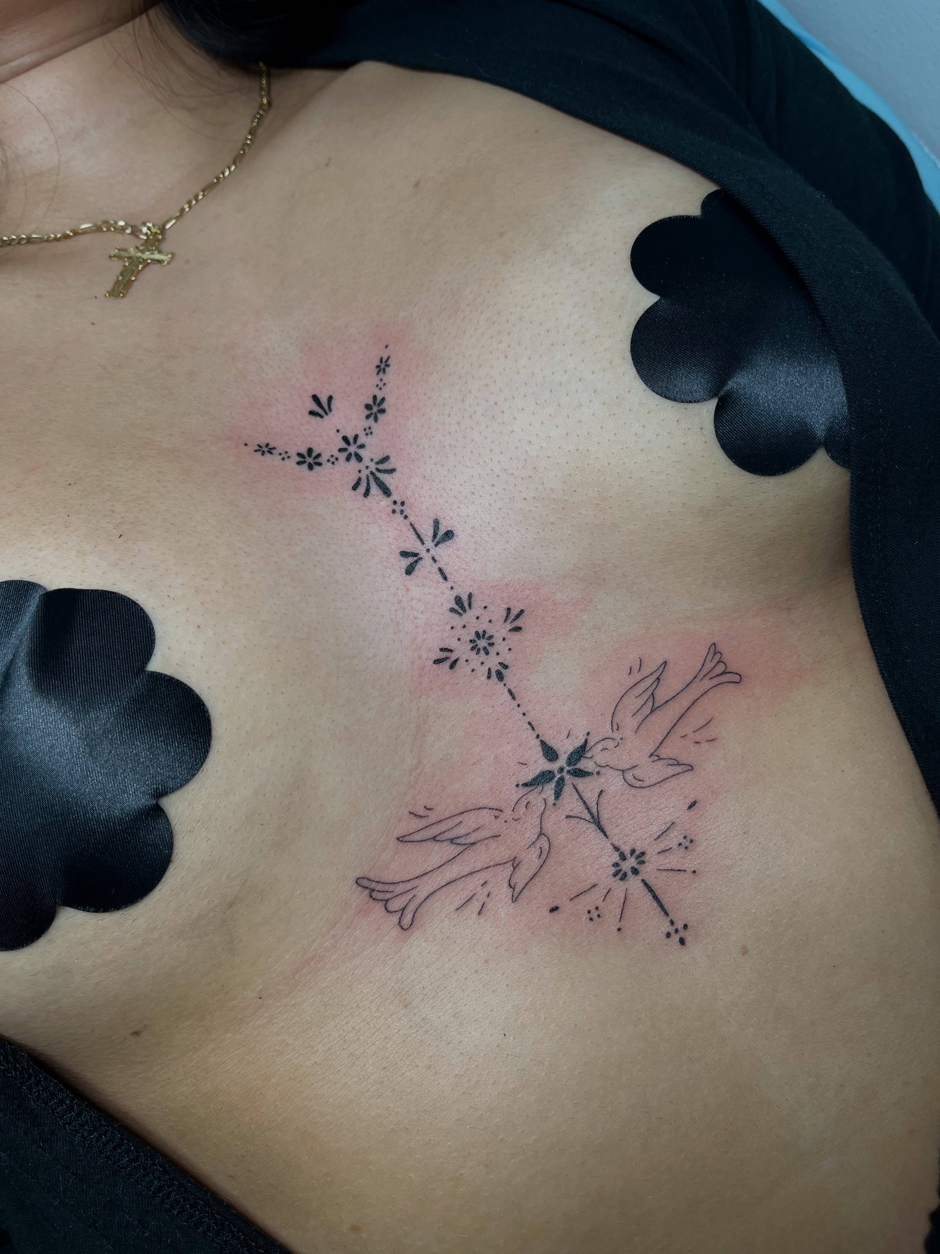 Birds and flowers dotwork tattoo on the ribs by christina diaz