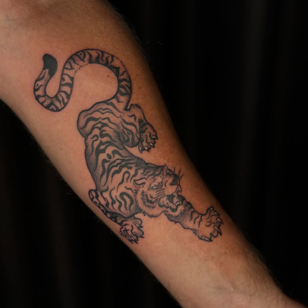 Tiger and snake black and grey tattoo on the forearm by ✧˖°. Jordan