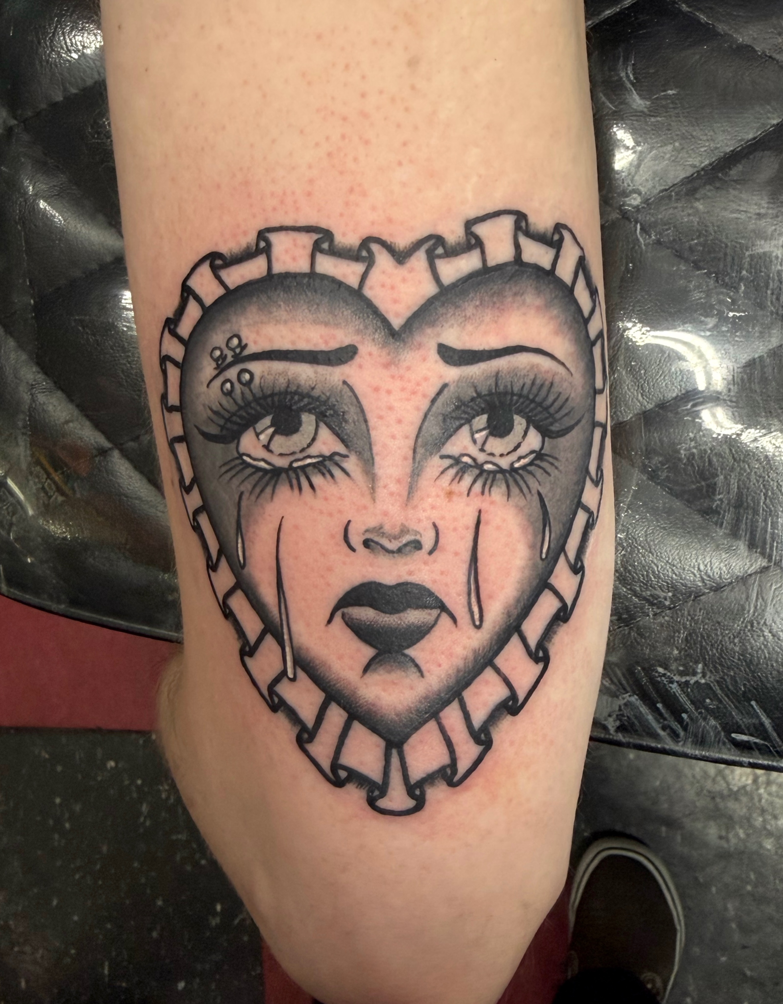 Heart-shaped face American traditional tattoo on the forearm by Patrick Miller, Huber Heights, Ohio