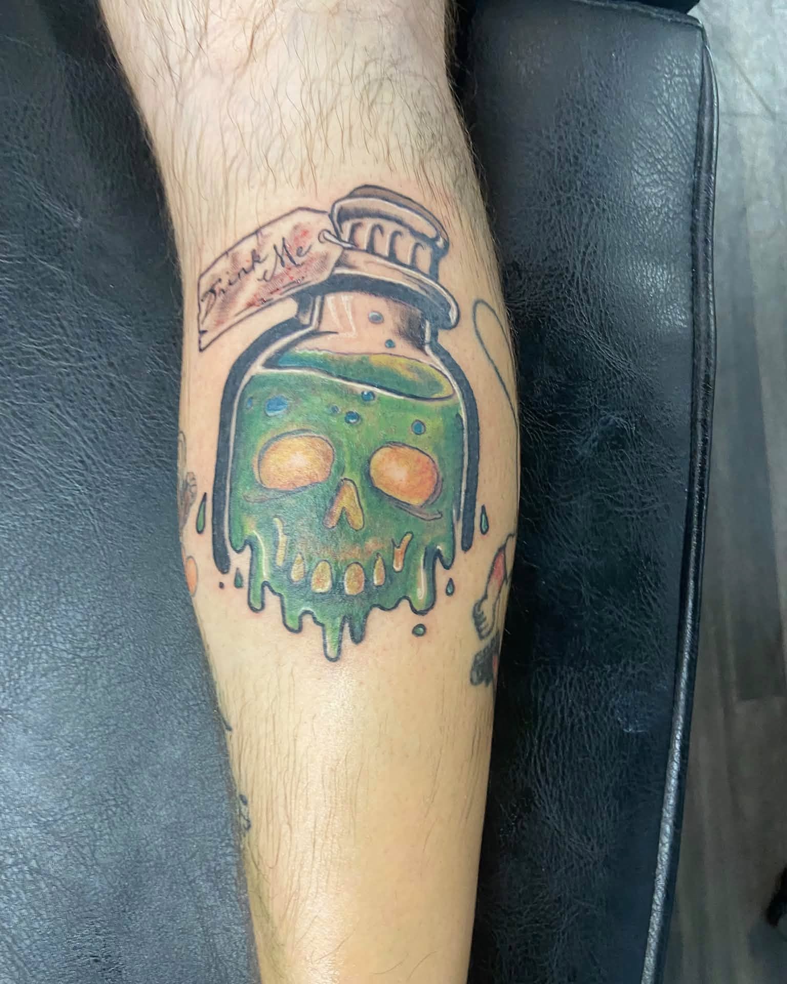 Poison bottle with skull dotwork tattoo on the forearm by Mike Berry