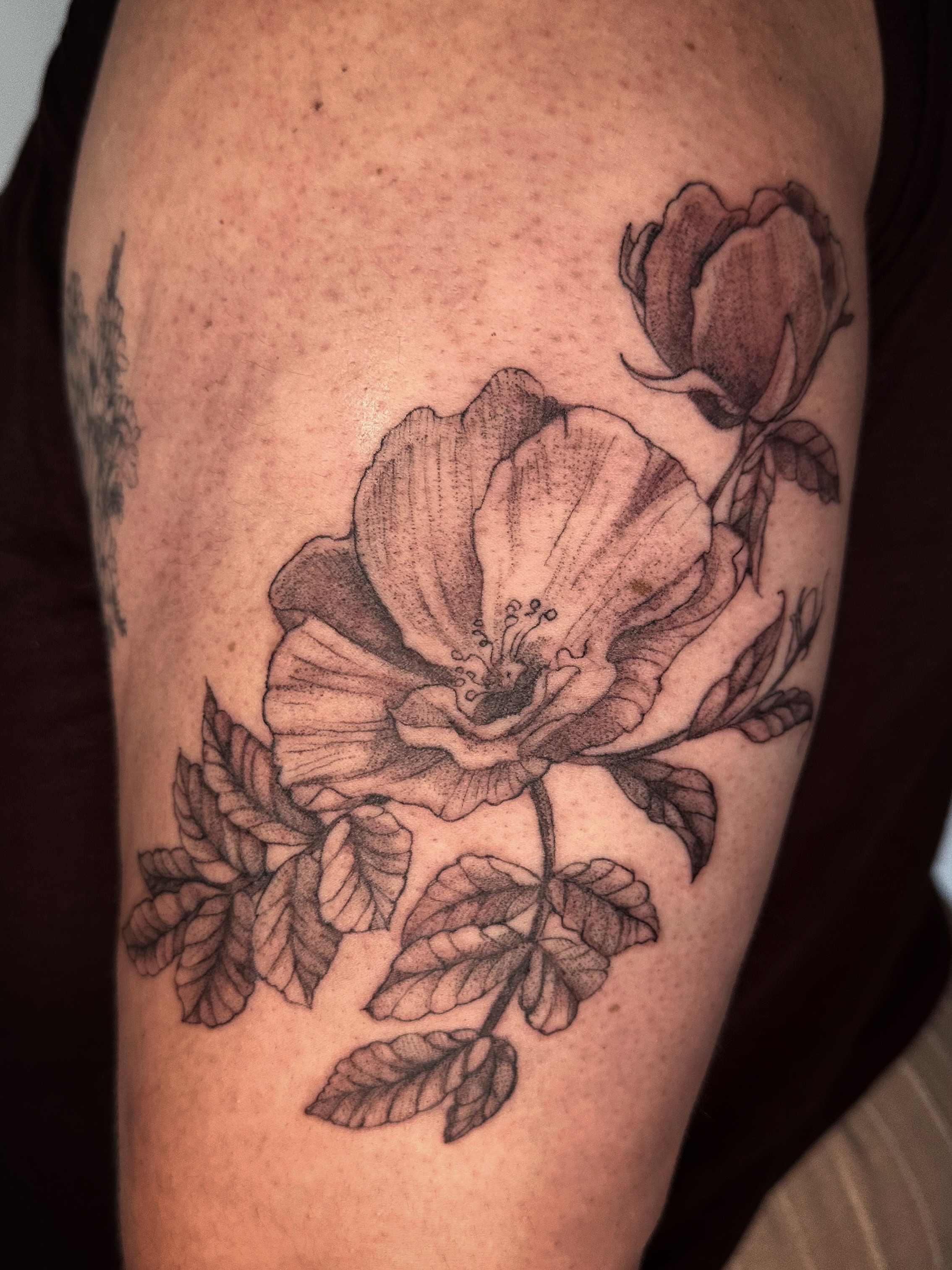 Flower bouquet black and grey tattoo on the thigh by Sadie Spades Philly Tattoos