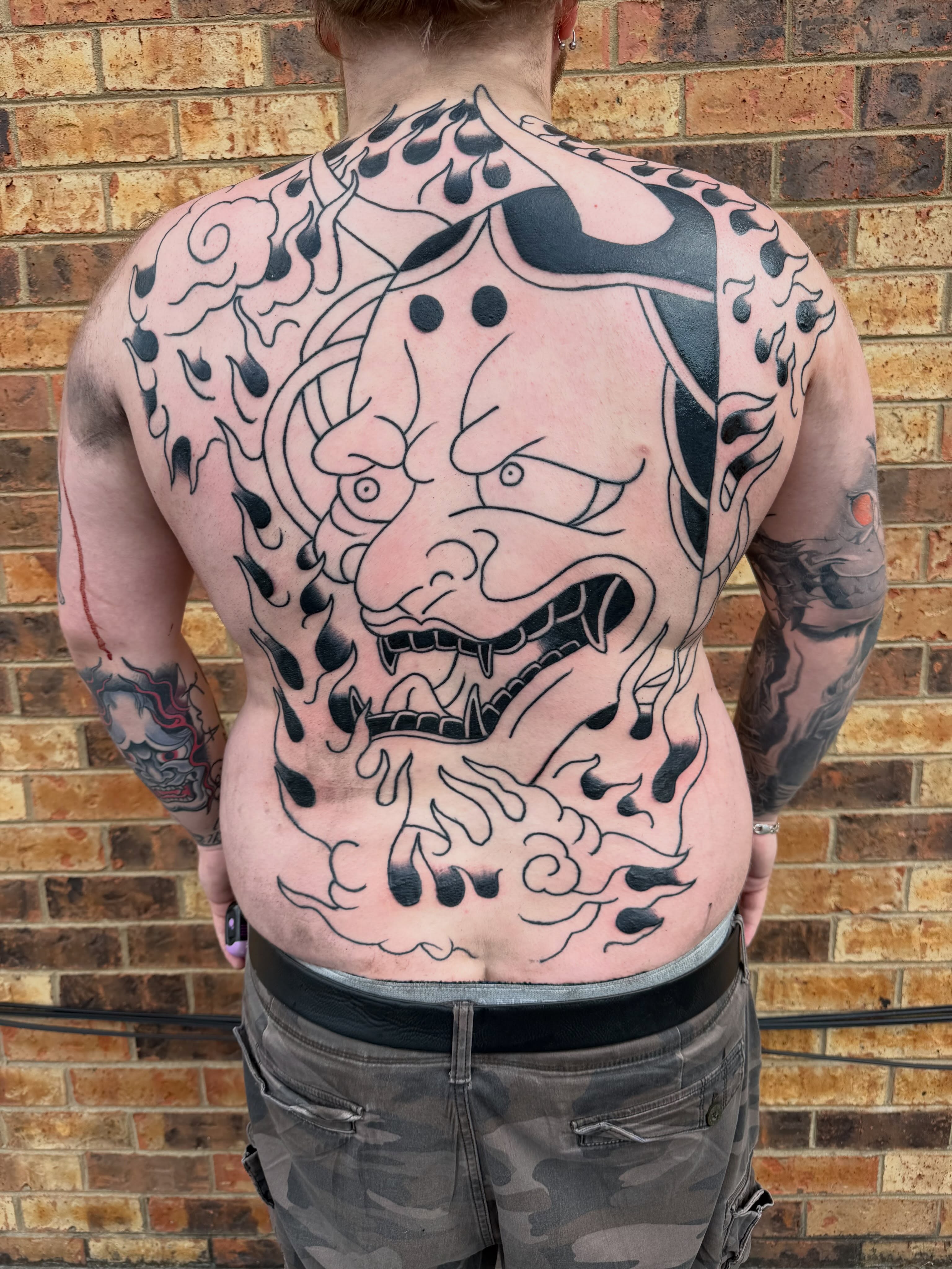 Demon face japanese irezumi tattoo on the back by Don Lee