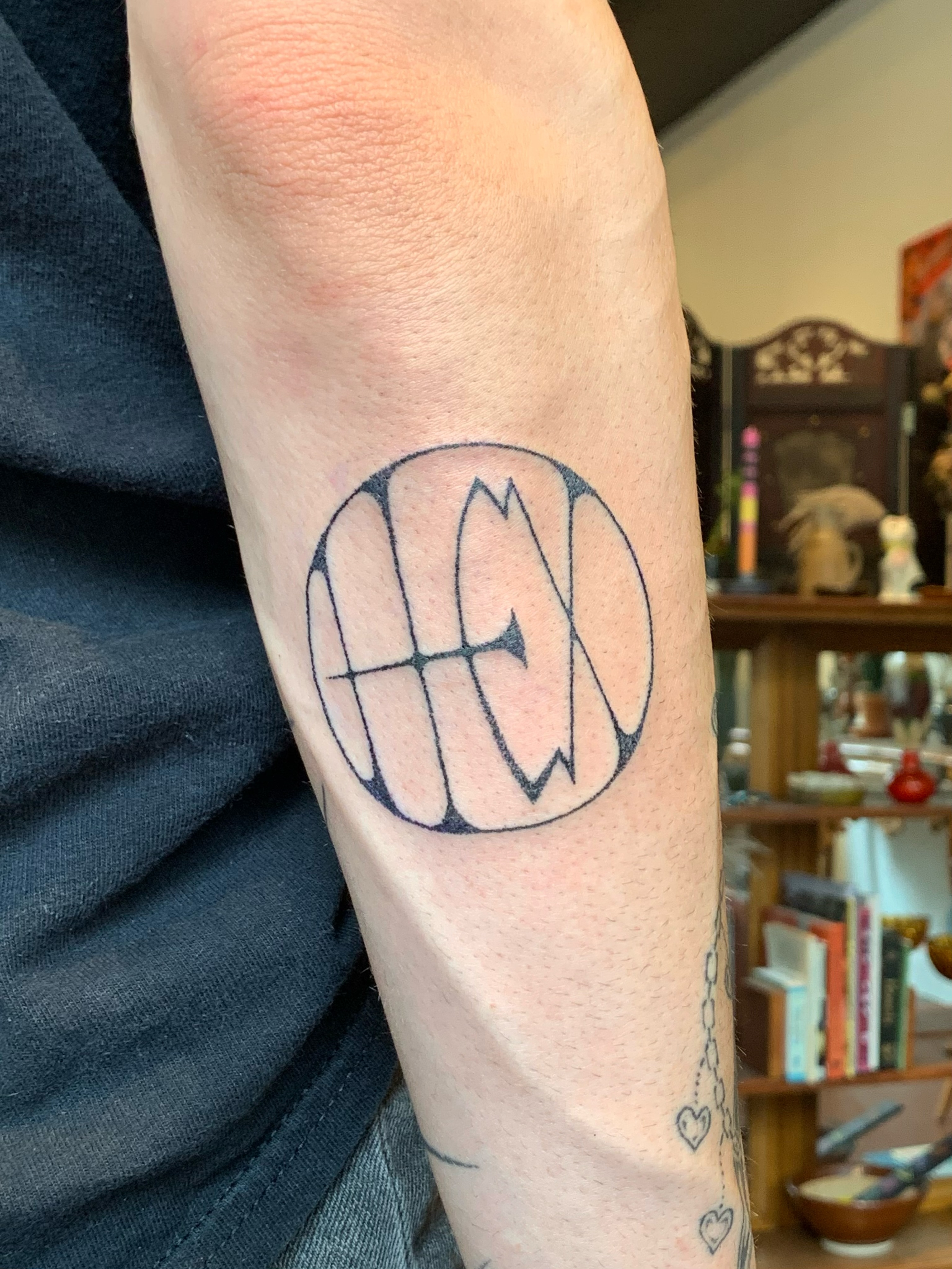 Geometric design geometric tattoo on the forearm by Lex Lloyd