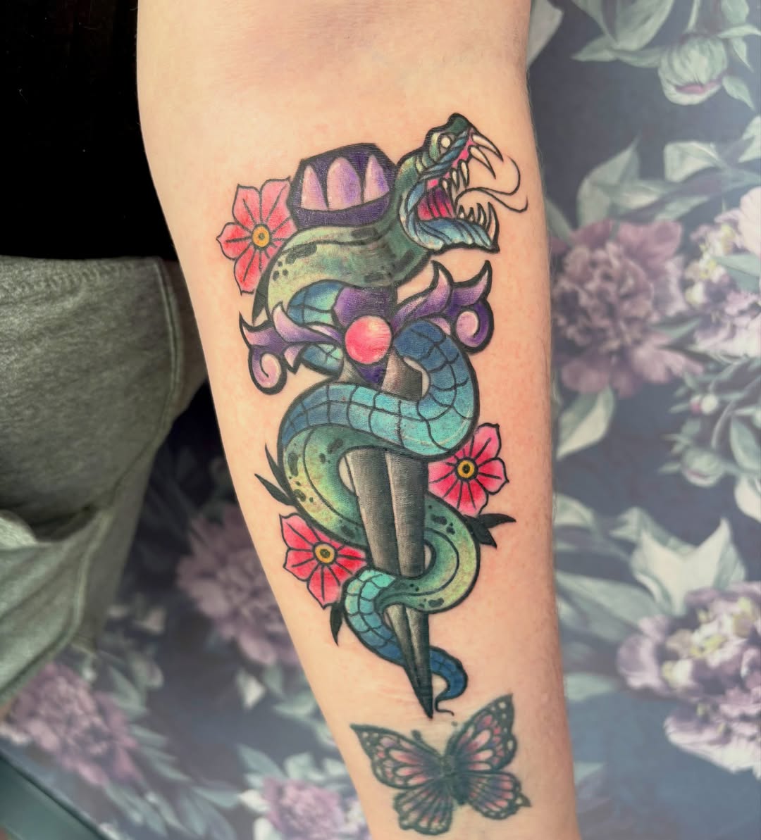 Snake and dagger American traditional tattoo on the forearm by Bre Alex