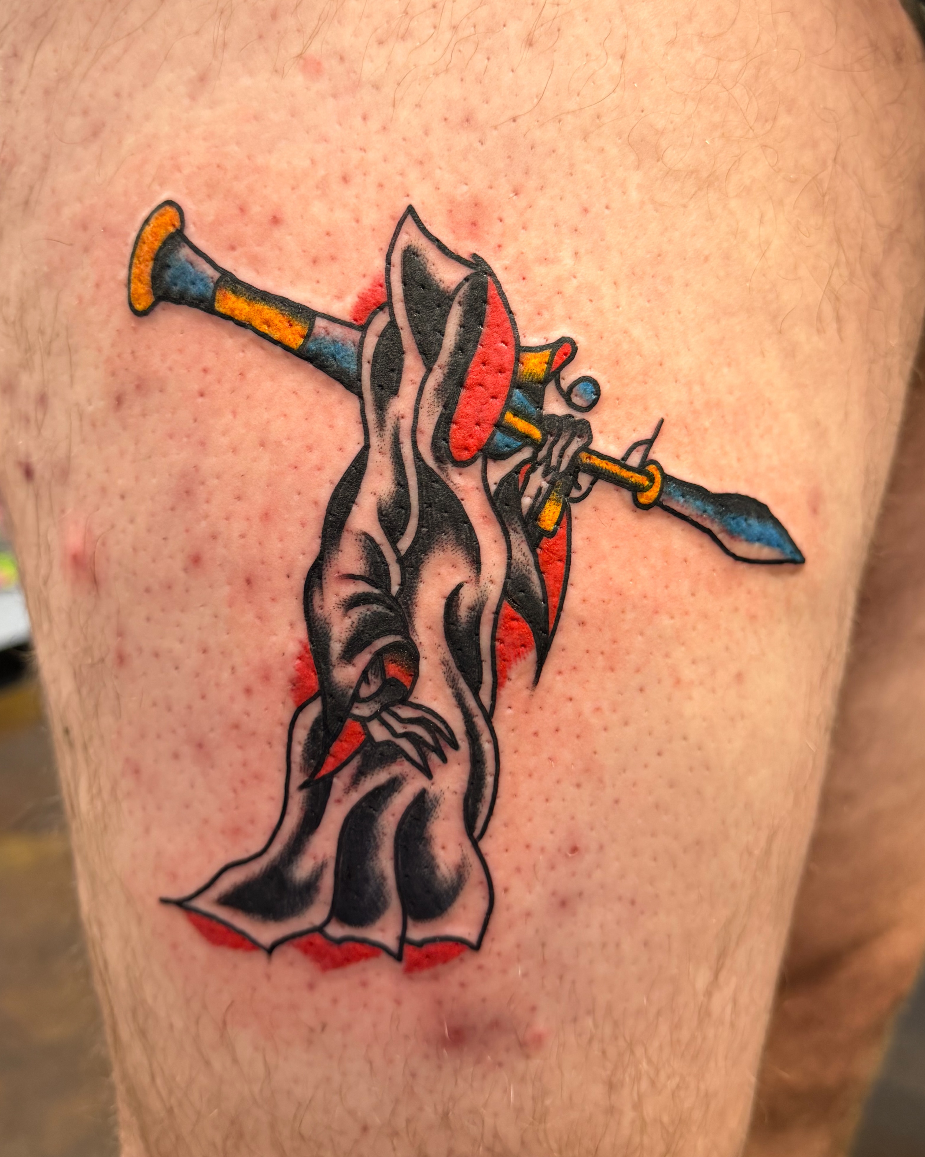 Flute player American traditional tattoo on the thigh by Zac Tattooer