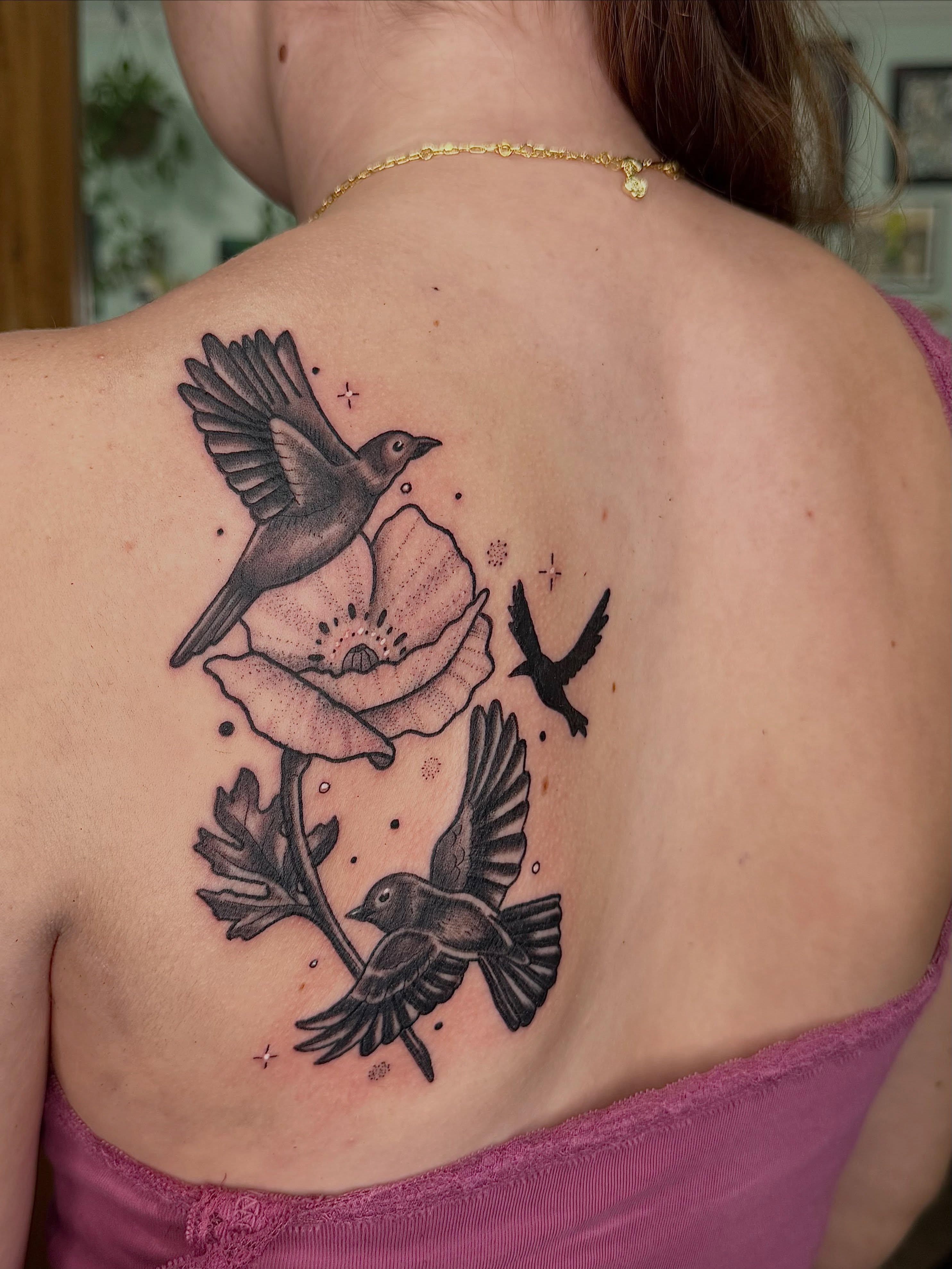 Birds and poppy dotwork tattoo on the back by AJ Jensen