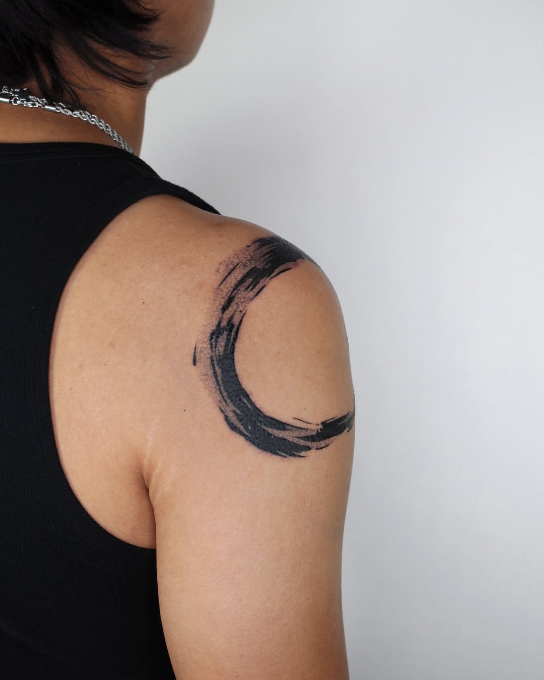 Brushstroke circle tribal tattoo on the shoulder by Piao