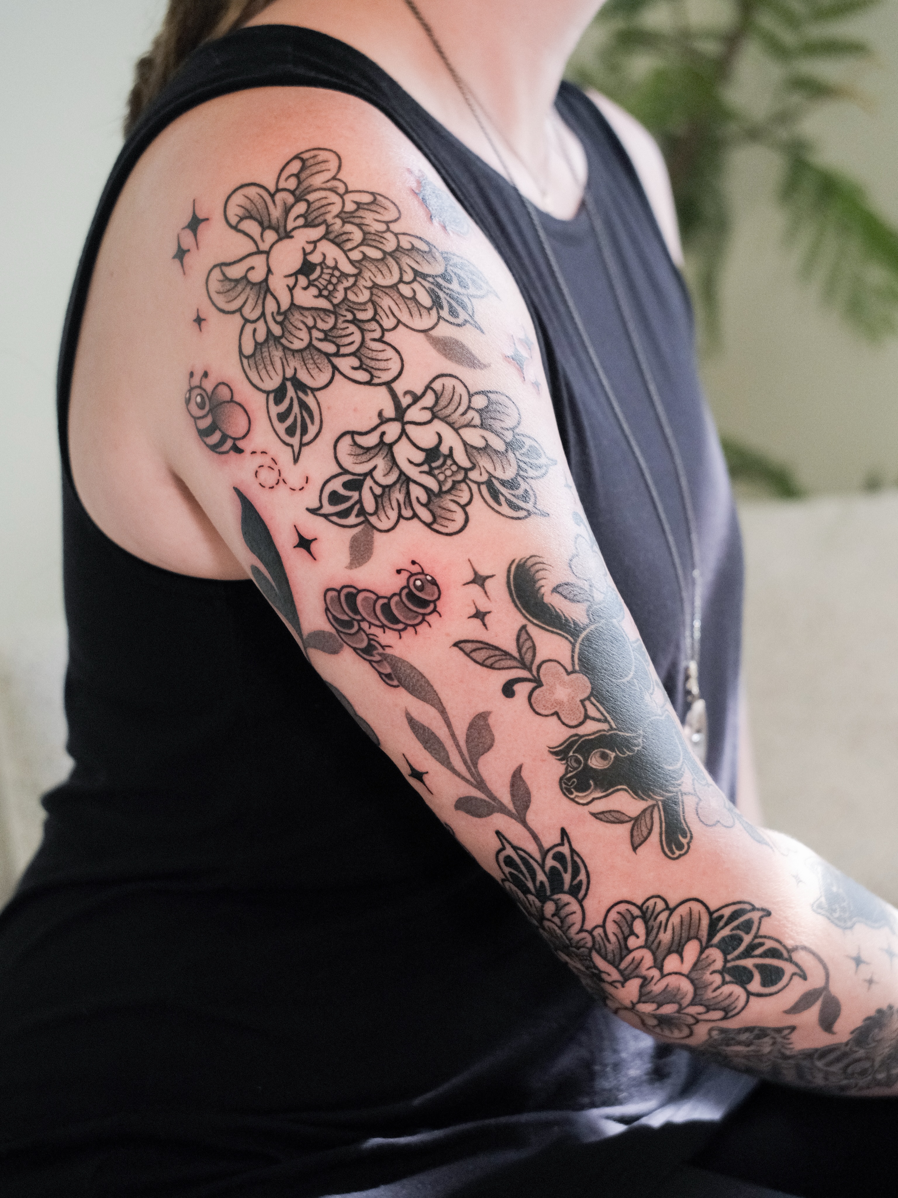 Floral bouquet American traditional tattoo on the upper arm by seattle tattoo artist