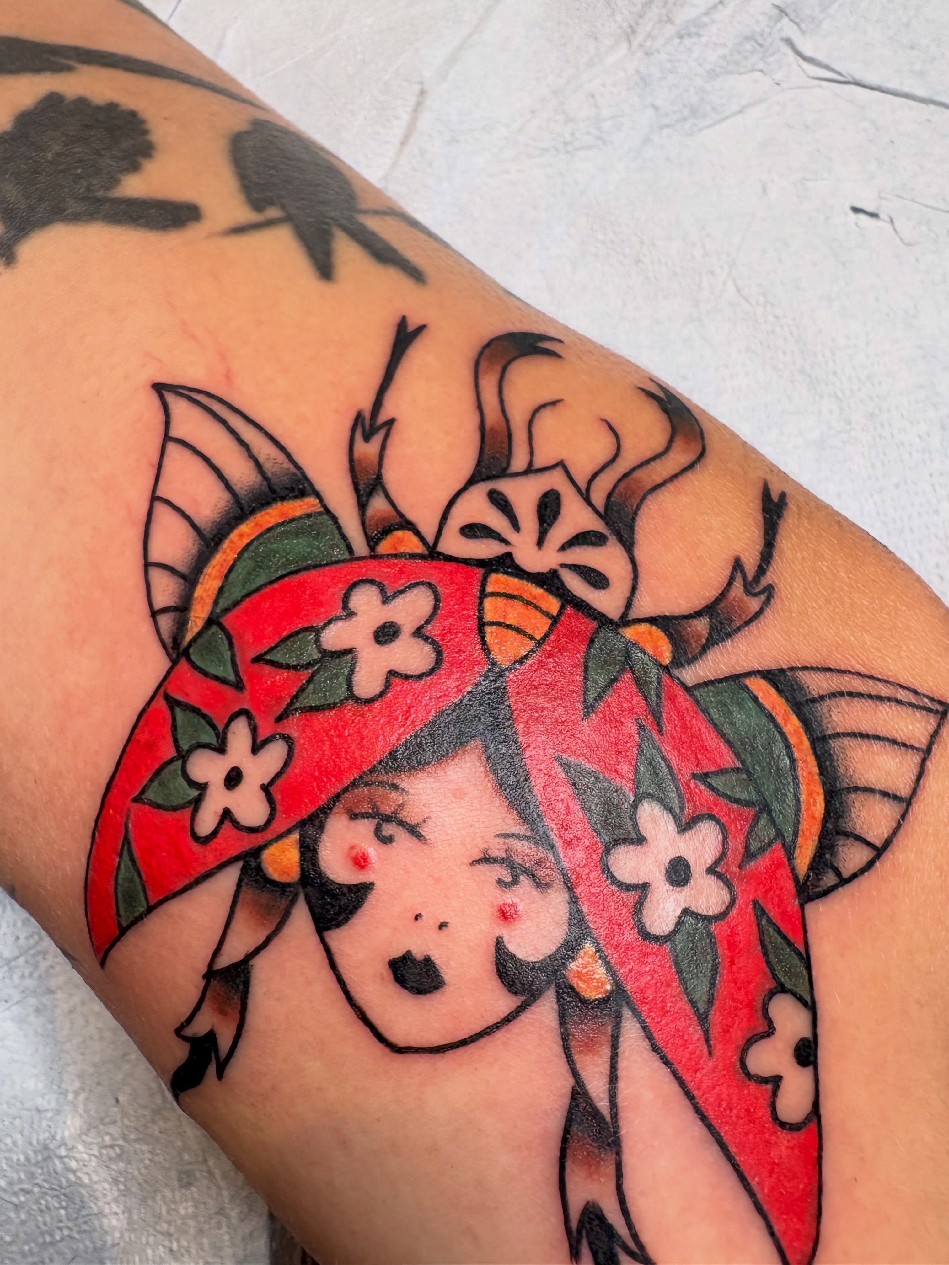 Geisha American traditional tattoo on the forearm by ellie