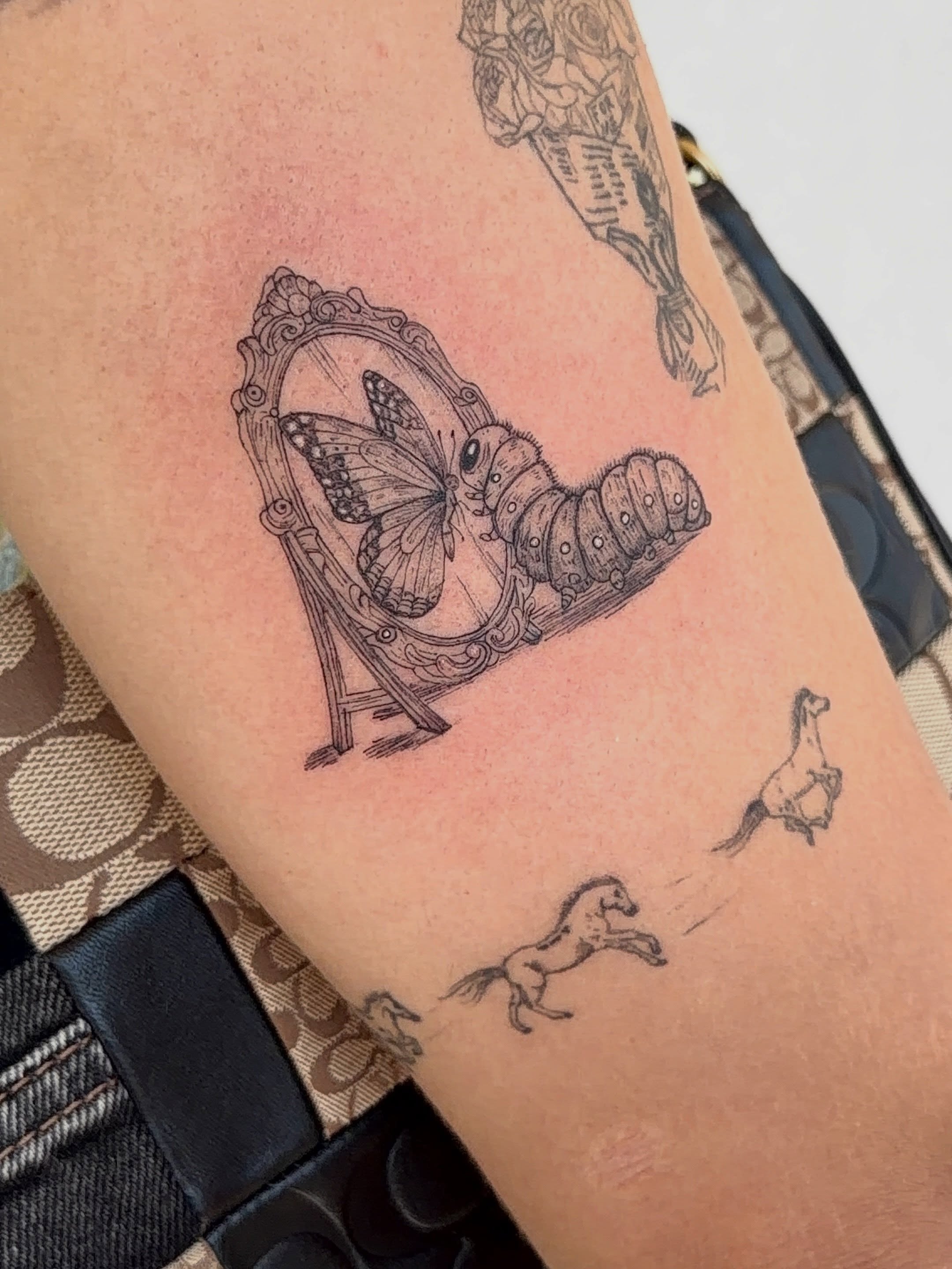 Caterpillar and butterfly black and grey tattoo on the forearm by Jacksyn, Plano, Texas