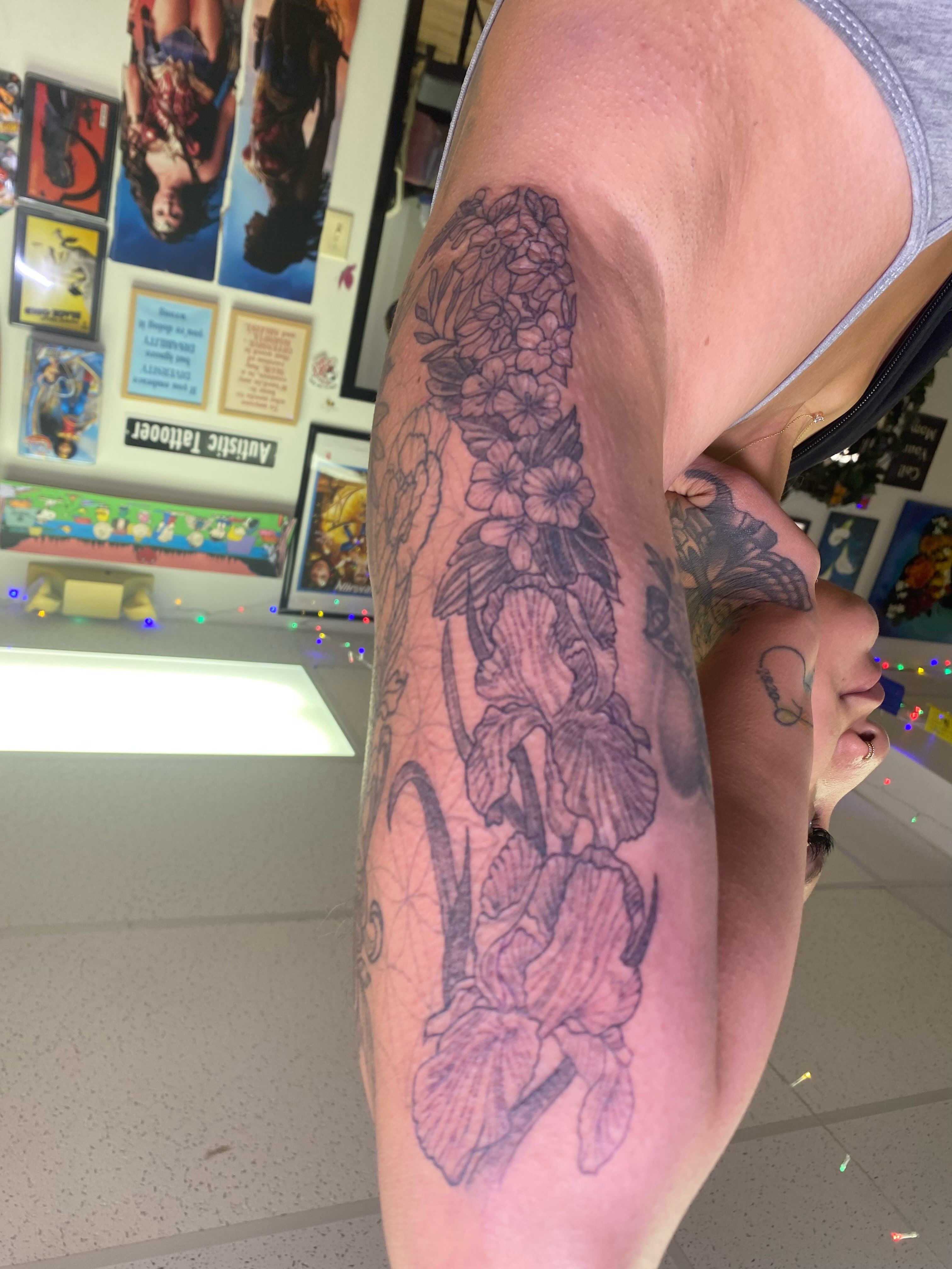 Floral arrangement black and grey tattoo on the forearm by Katie Leeper