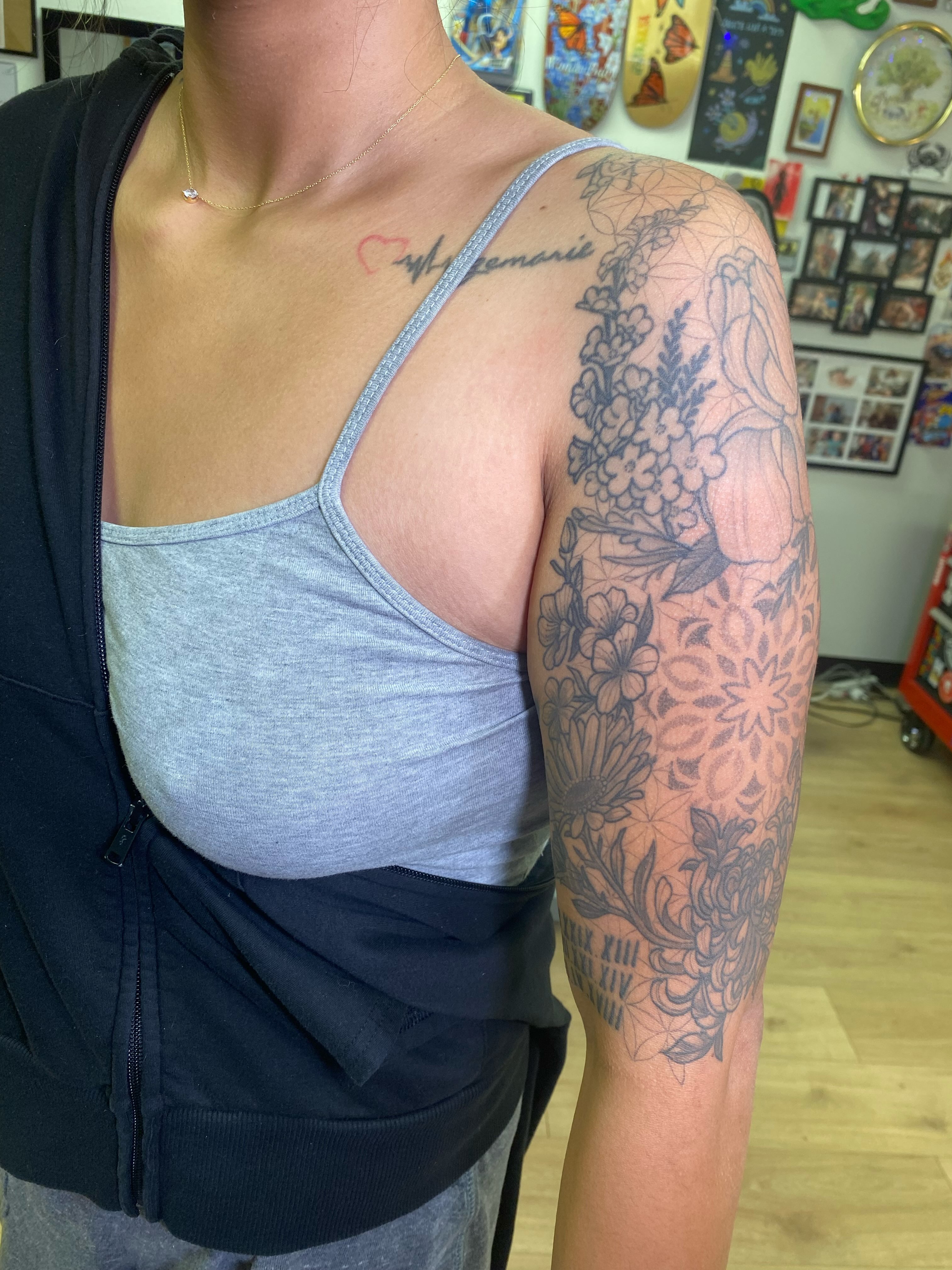 Floral mandala geometric tattoo on the upper arm by Katie Leeper