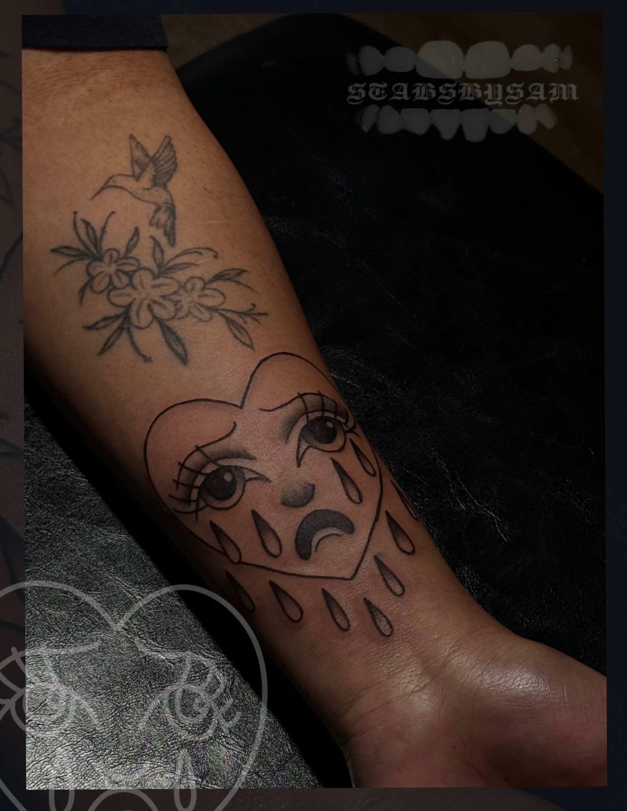 Tearful heart black and grey tattoo on the forearm by licensed charlotte tattoo artist