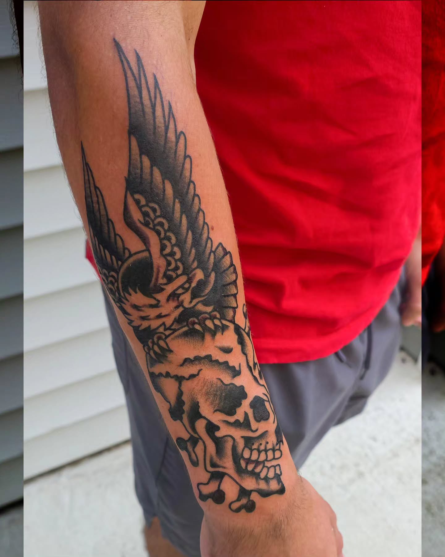 Skull and eagle American traditional tattoo on the forearm by J. Kirsch New Jersey Tattoo Artist