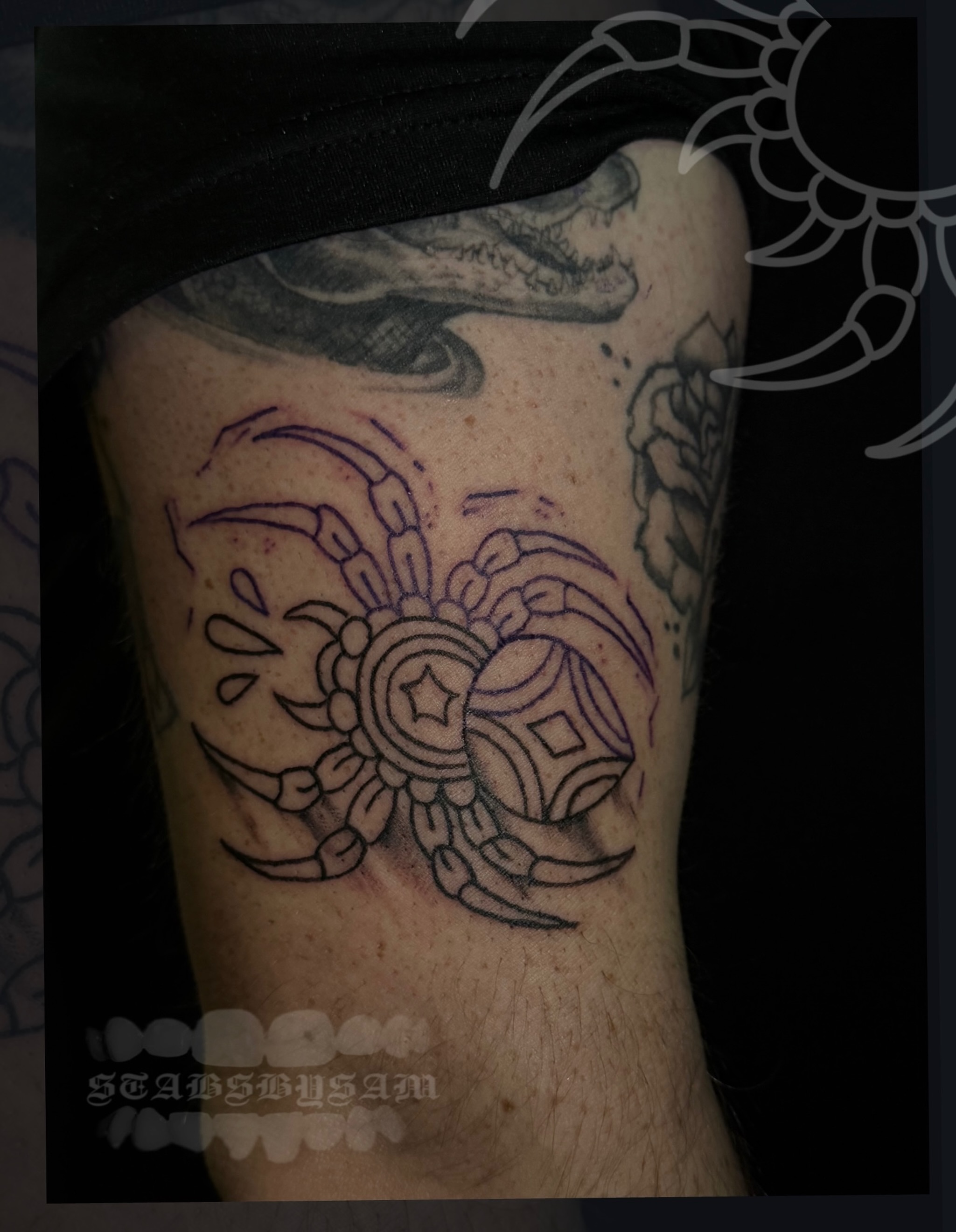 Crab geometric tattoo on the forearm by licensed charlotte tattoo artist