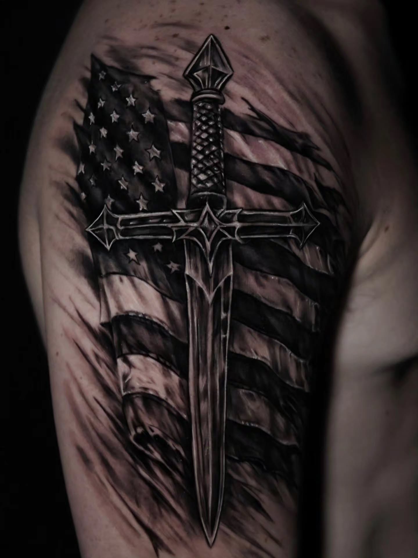 Sword and American flag geometric tattoo on the shoulder by 𝐍𝐄𝐗'𝐒 𝐈𝐍𝐊 🇨🇺, Tampa