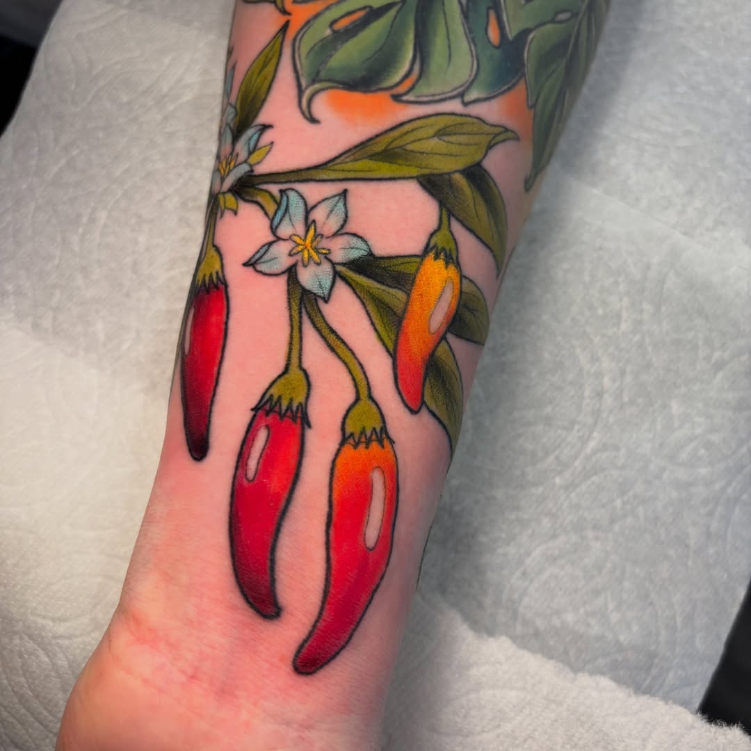 Chili peppers and flowers new school tattoo on the forearm by ✨REiD✨