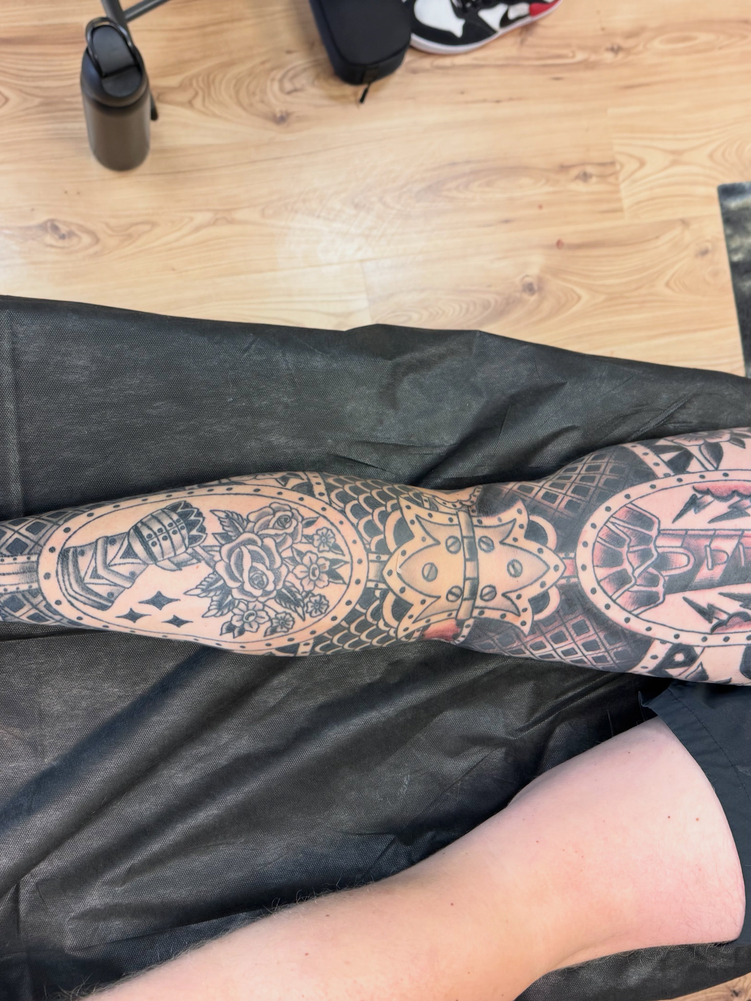 Floral and geometric design black and grey tattoo on the forearm by Justin Chapman, Des Moines, Iowa
