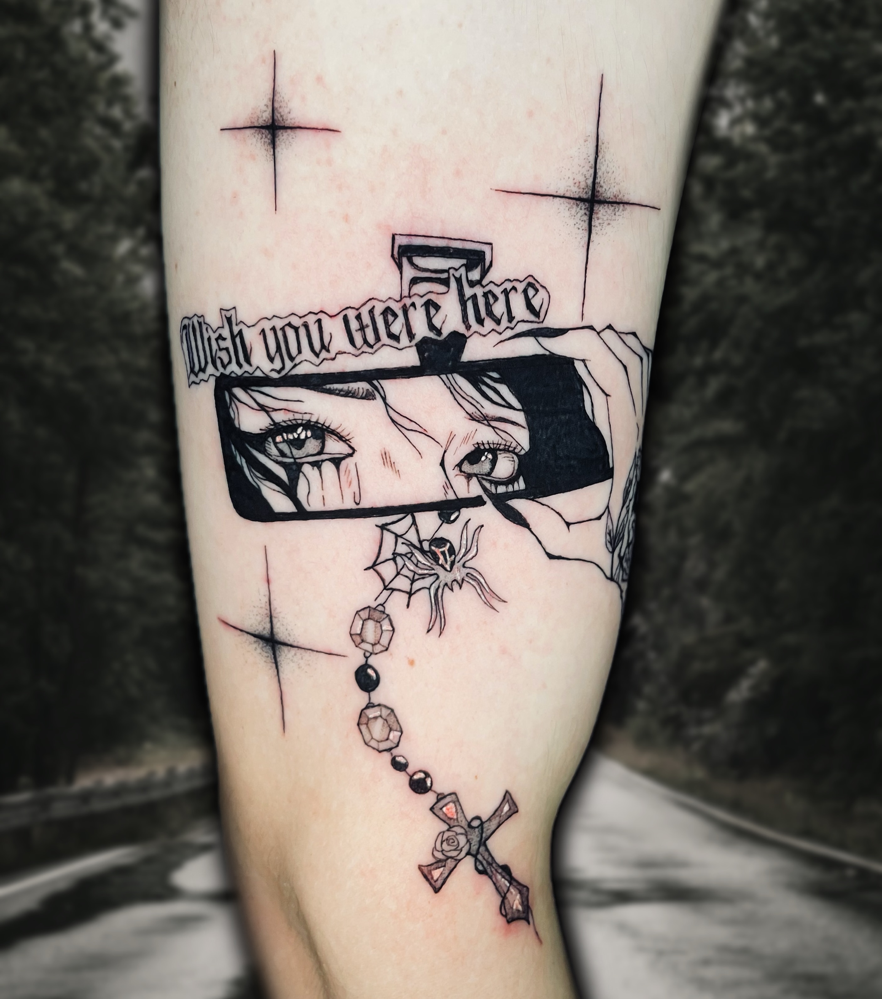 Eyes and cross realism tattoo on the forearm by Shontel Fowler