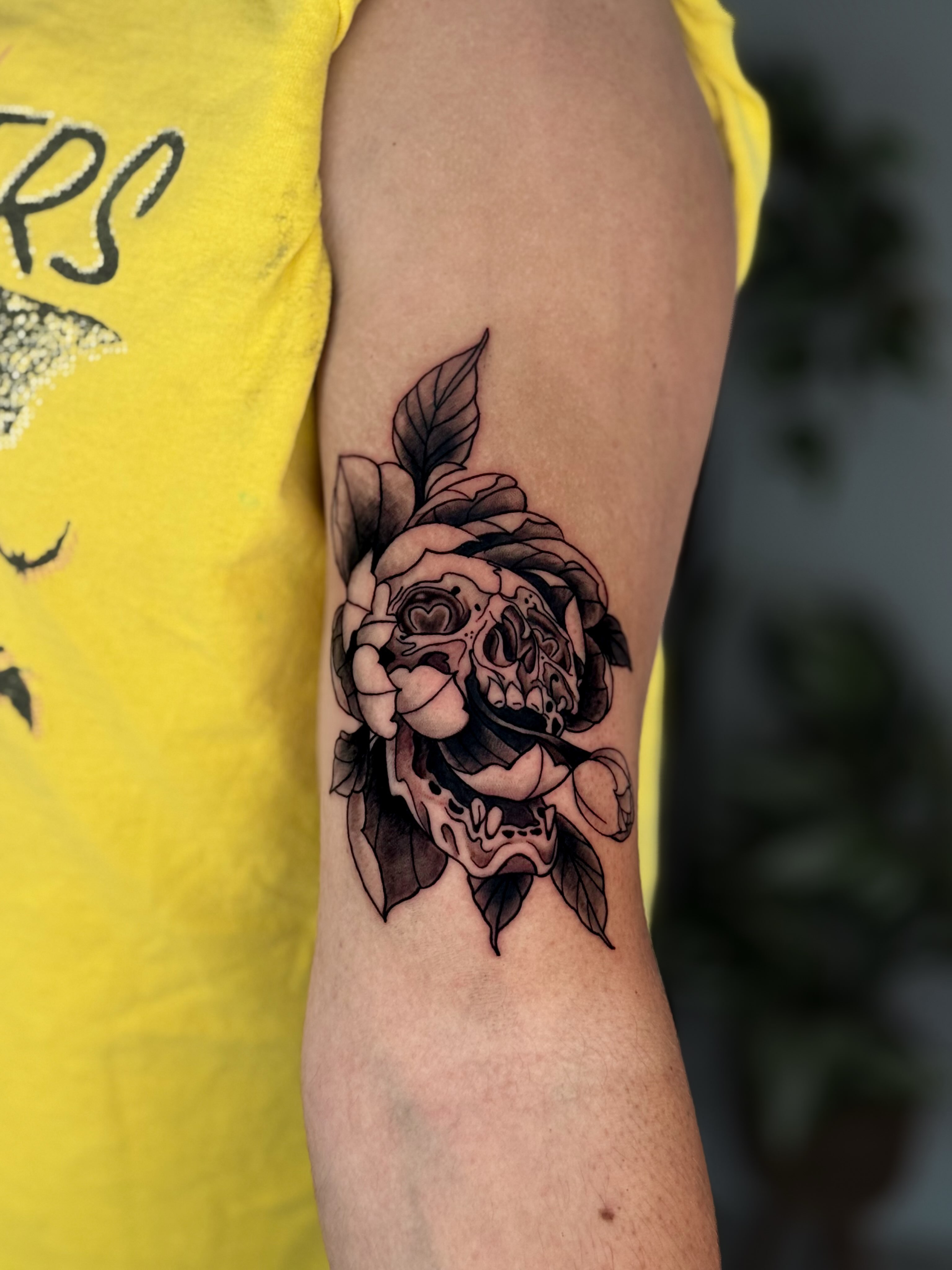 Skull and rose black and grey tattoo on the forearm by Kai, Charlotte, North Carolina