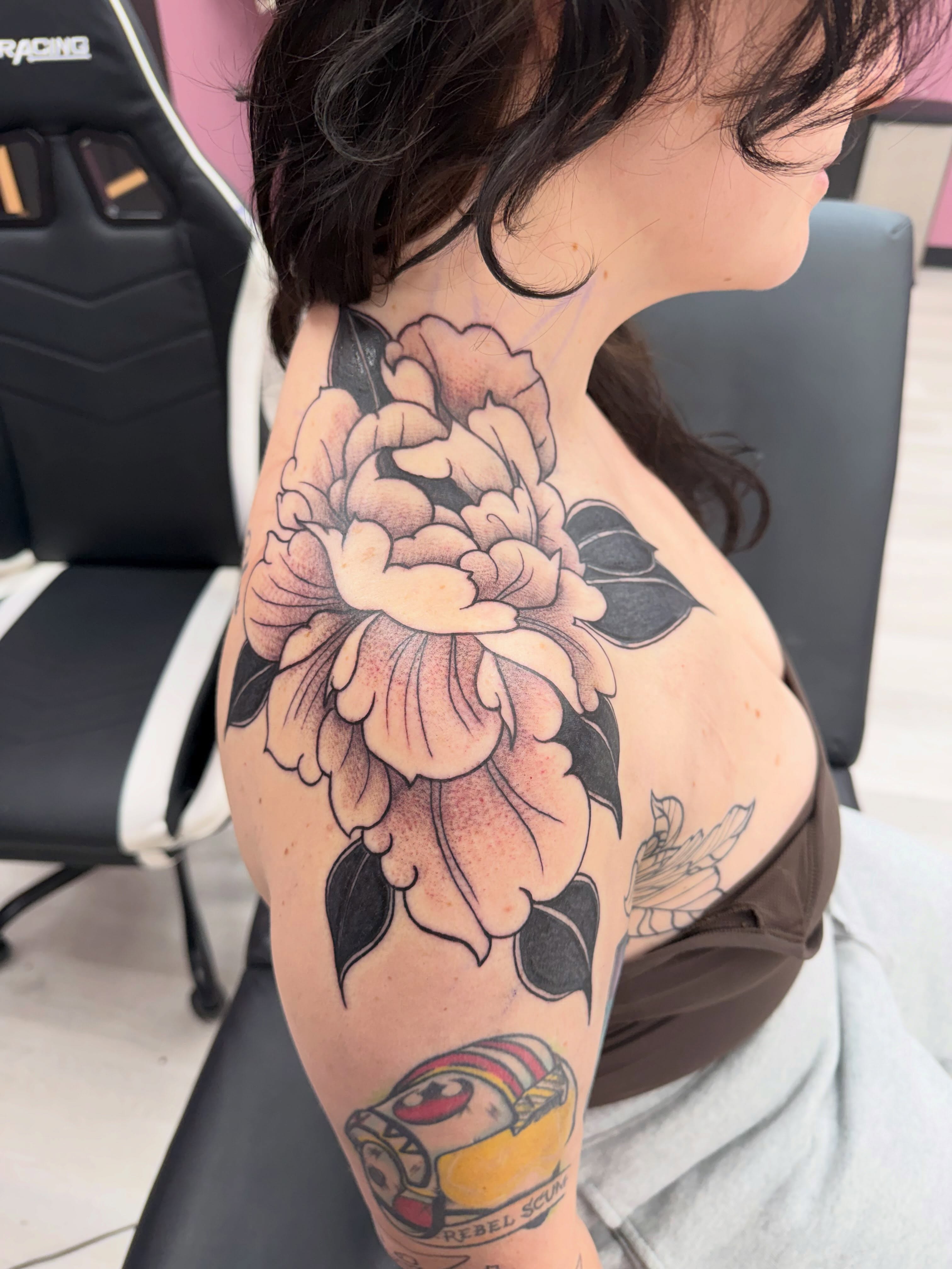 Peony flower American traditional tattoo on the shoulder by Lindsay