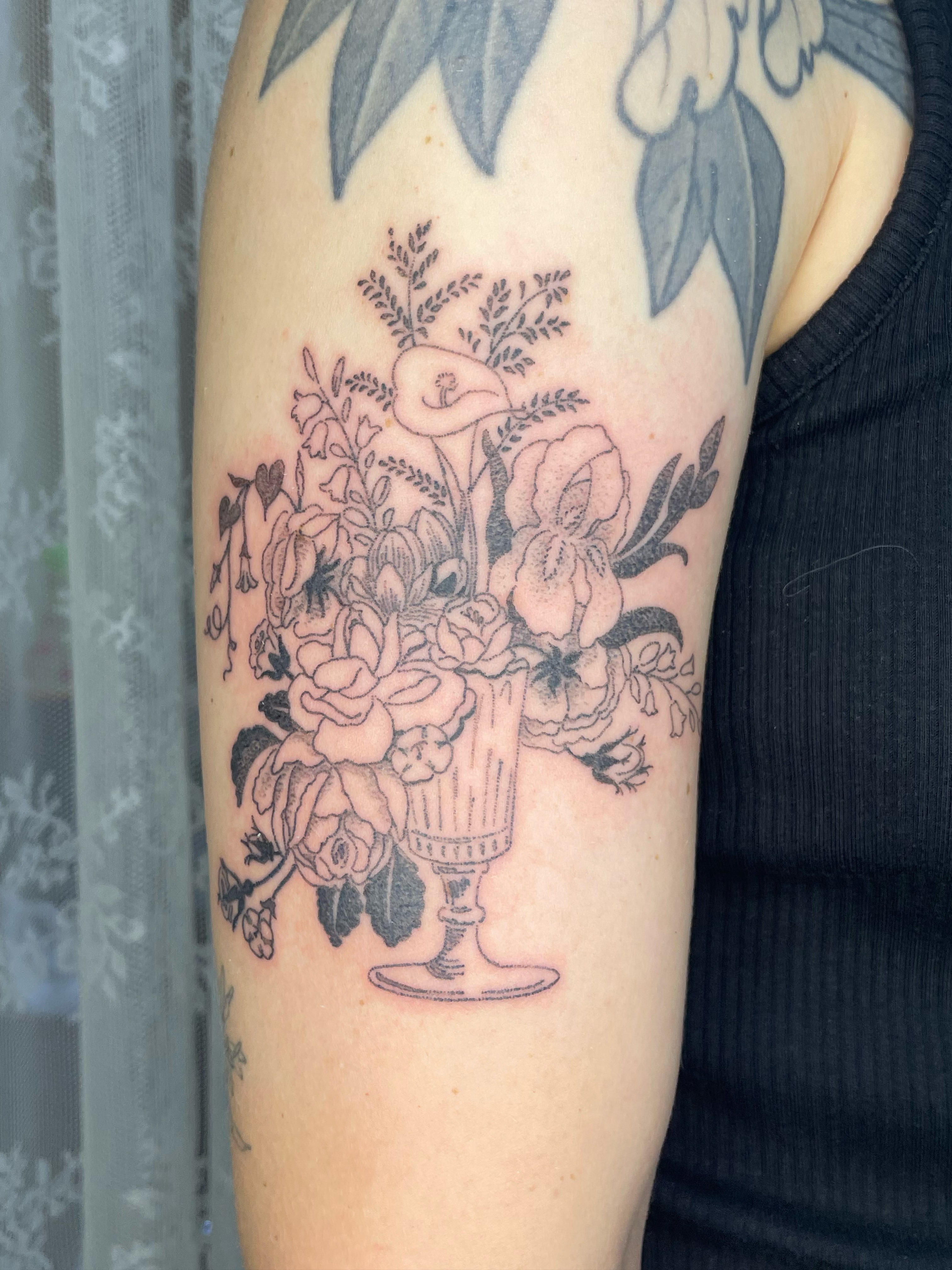 Flower bouquet black and grey tattoo on the forearm by cait