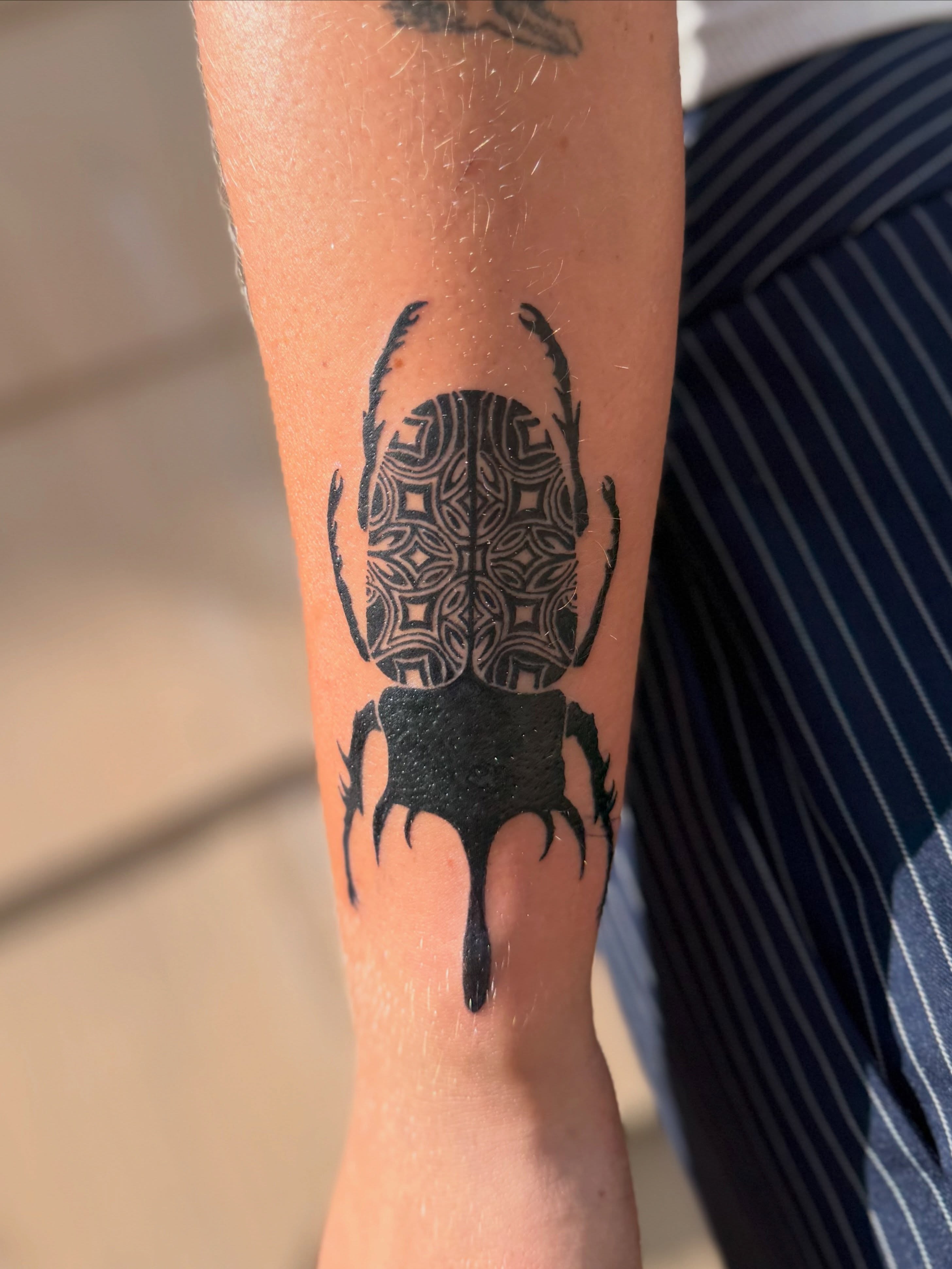 Scarab beetle geometric tattoo on the forearm by Jocelyne ♡