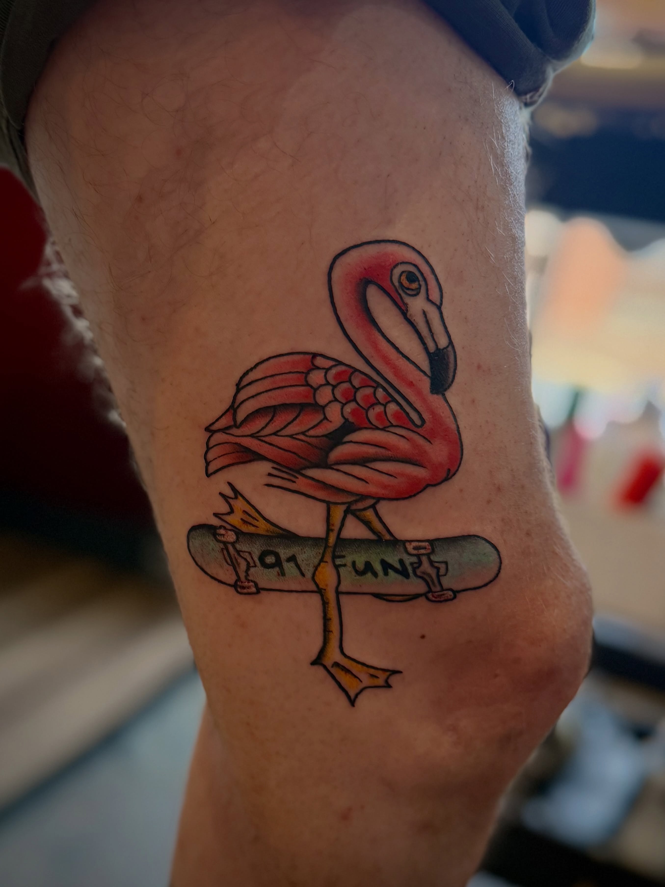 Flamingo on skateboard new school tattoo on the forearm by Stevie Reign