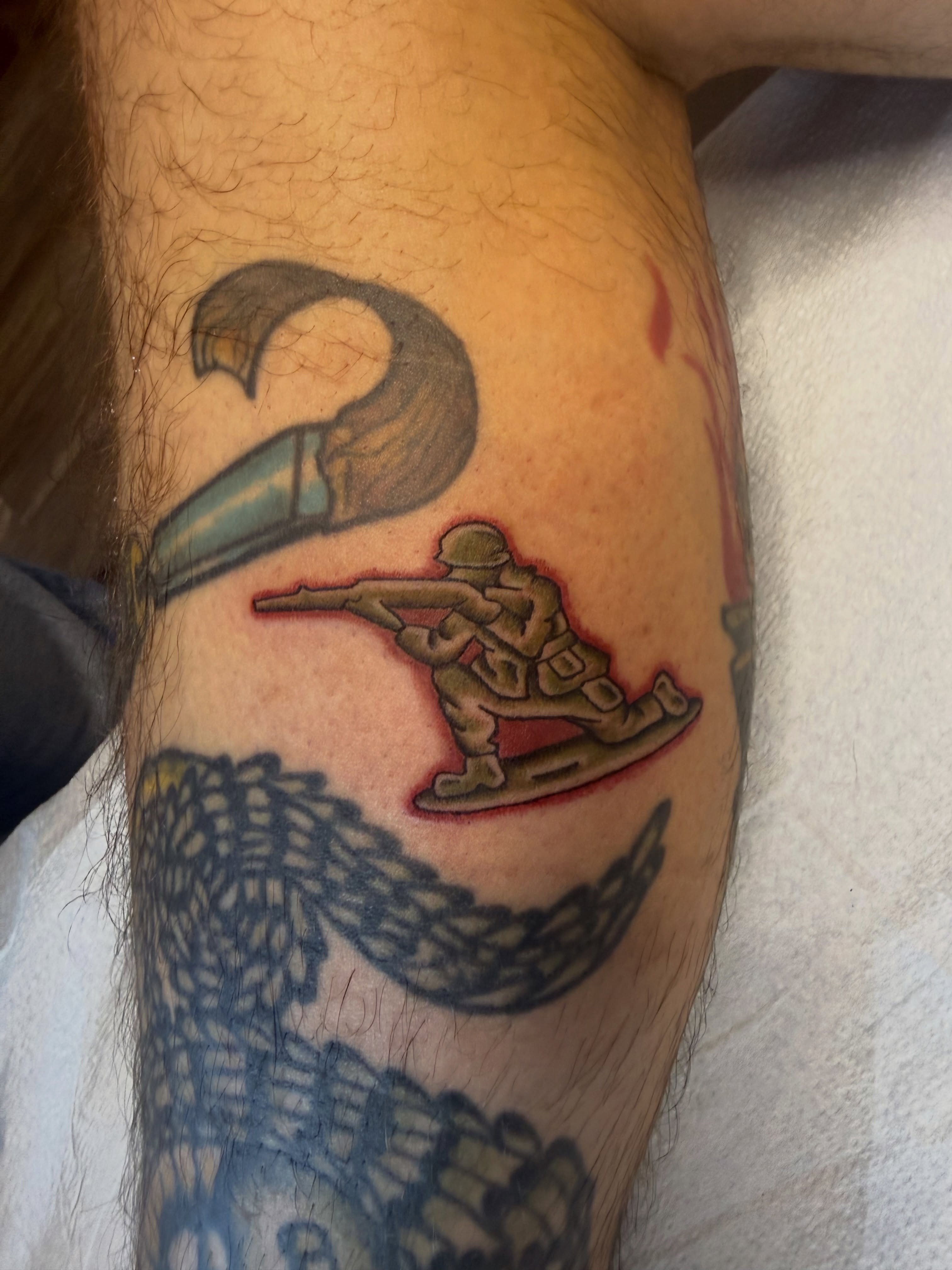 Soldier with rifle American traditional tattoo on the forearm by Stevie Reign