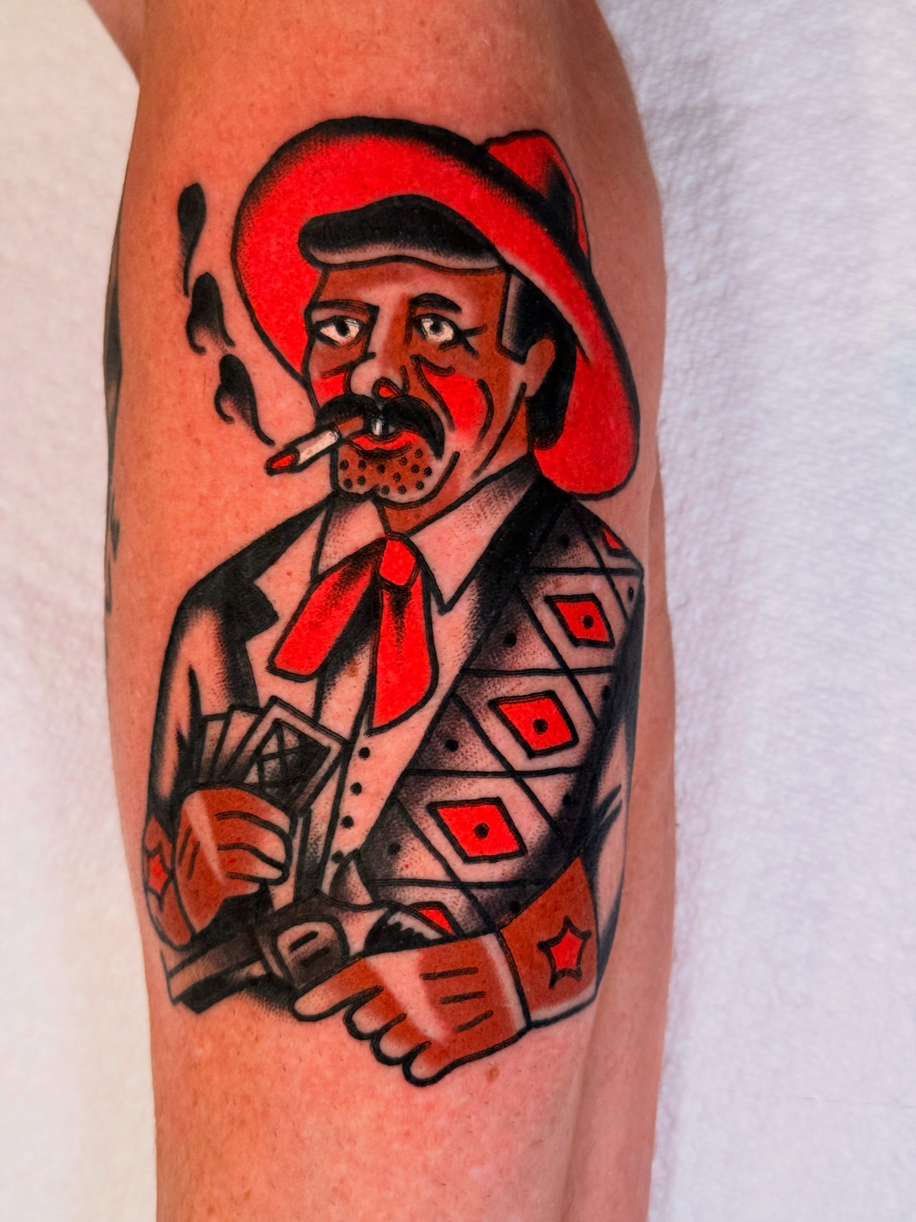 Man with mustache American traditional tattoo on the forearm by {{Theo Glanton}}