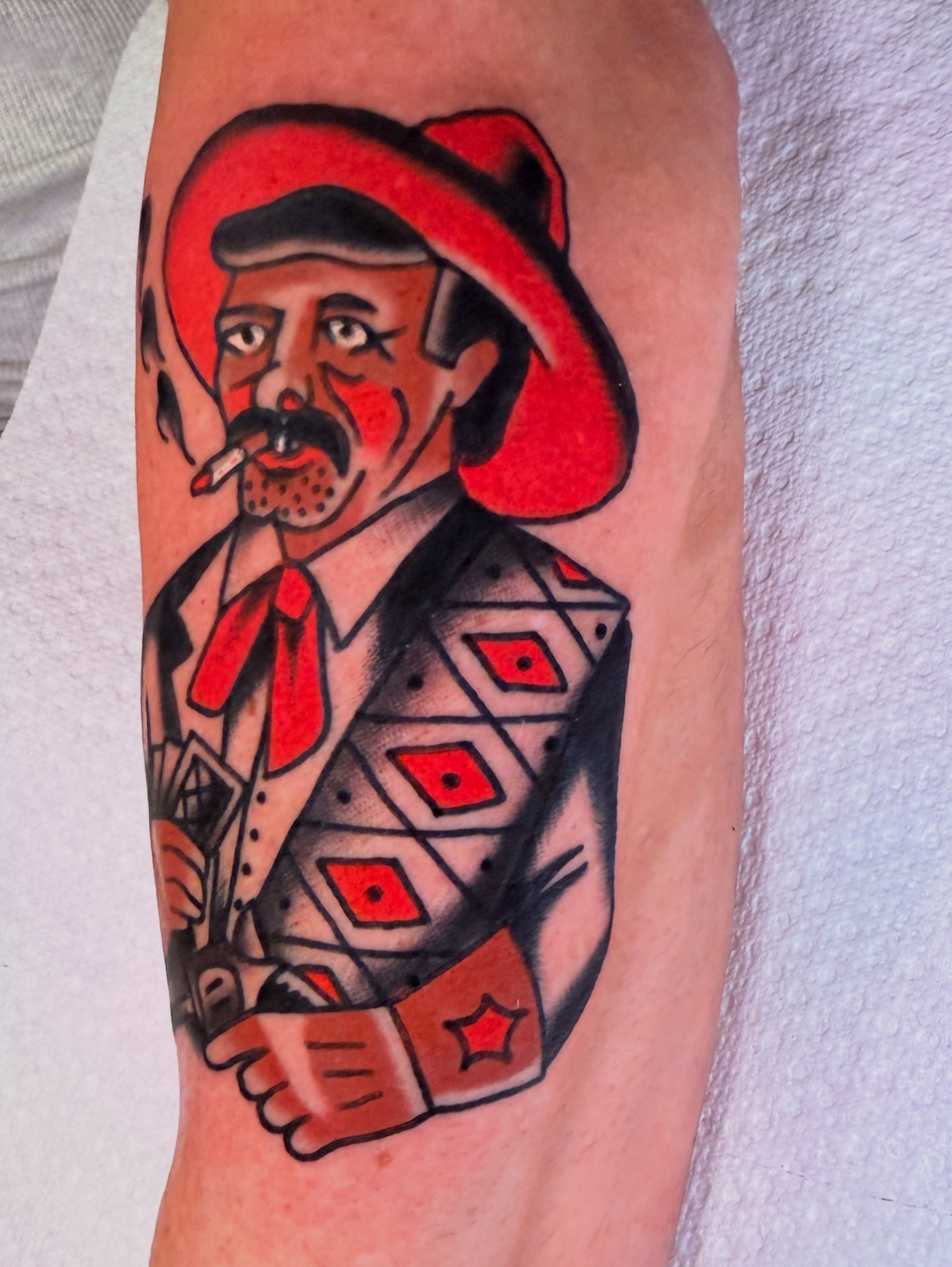 Cowboy American traditional tattoo on the forearm by {{Theo Glanton}}
