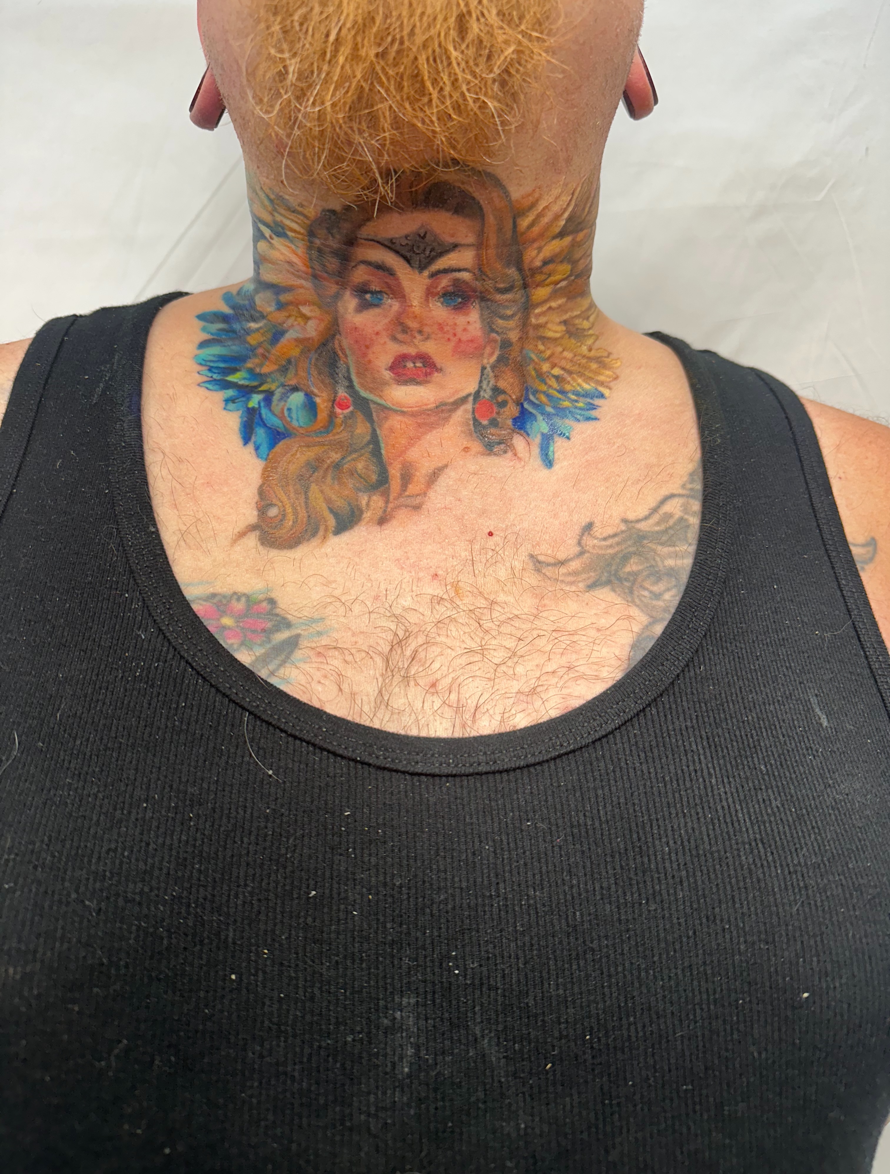 Woman's portrait realism tattoo on the neck by Elizabeth’s Eclectic Tattoos