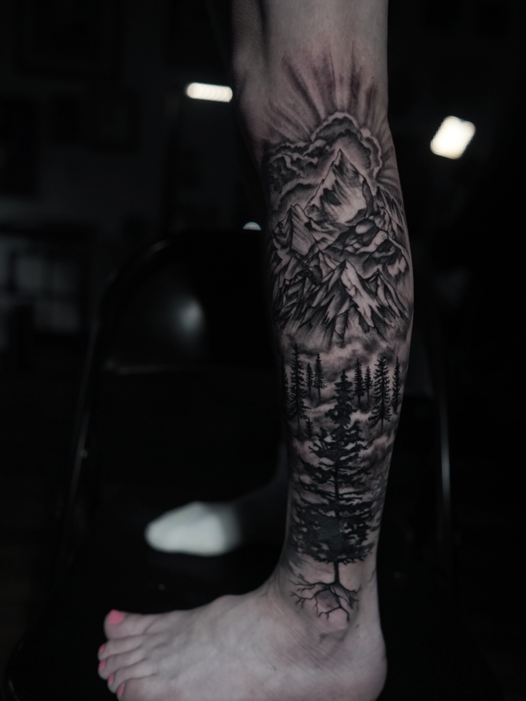 Mountain landscape realism tattoo on the forearm by Niko Hosk Cataldo