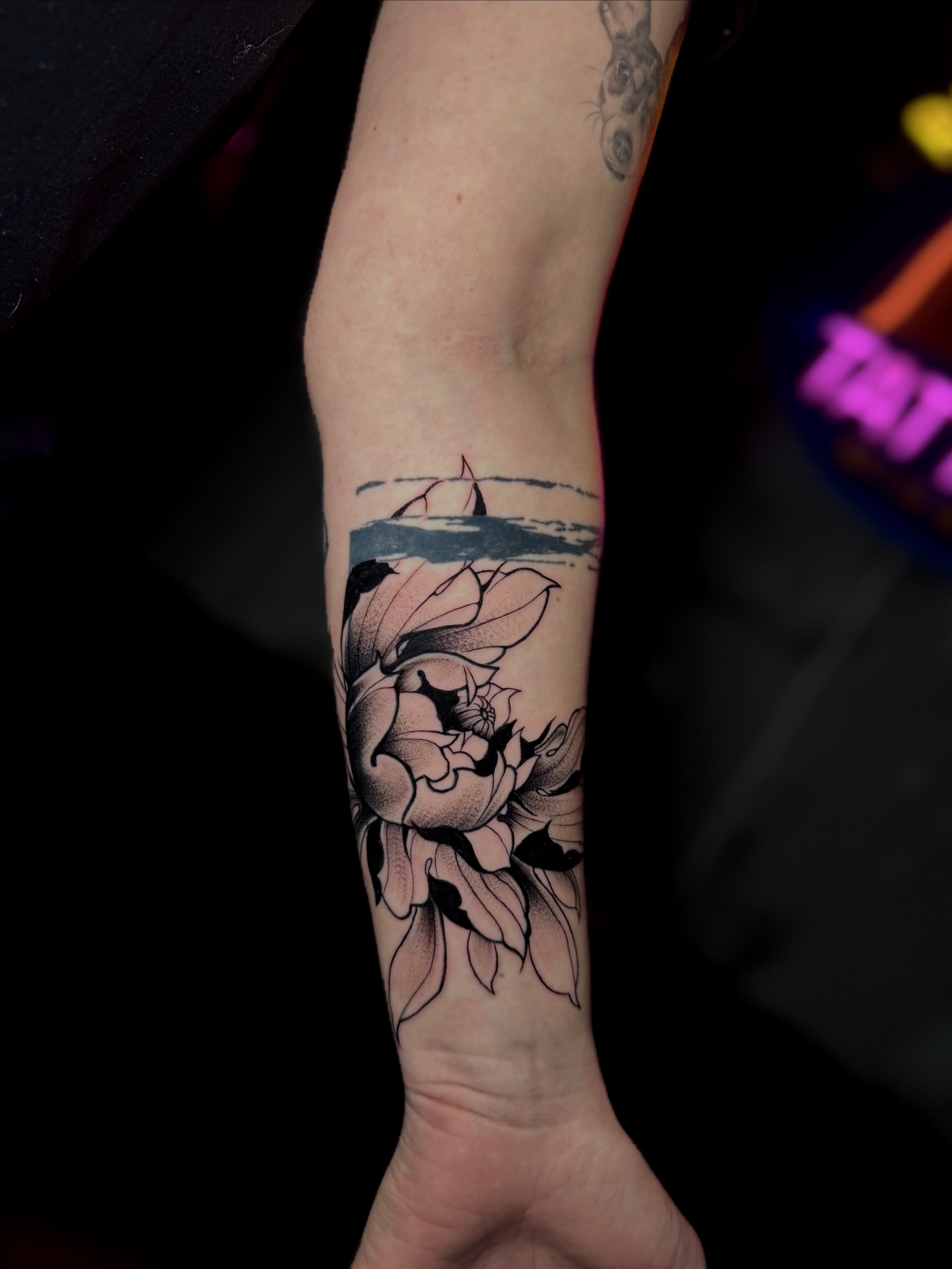 Flower and sailboats black and grey tattoo on the forearm by Keyla Valdes, Miami, Florida