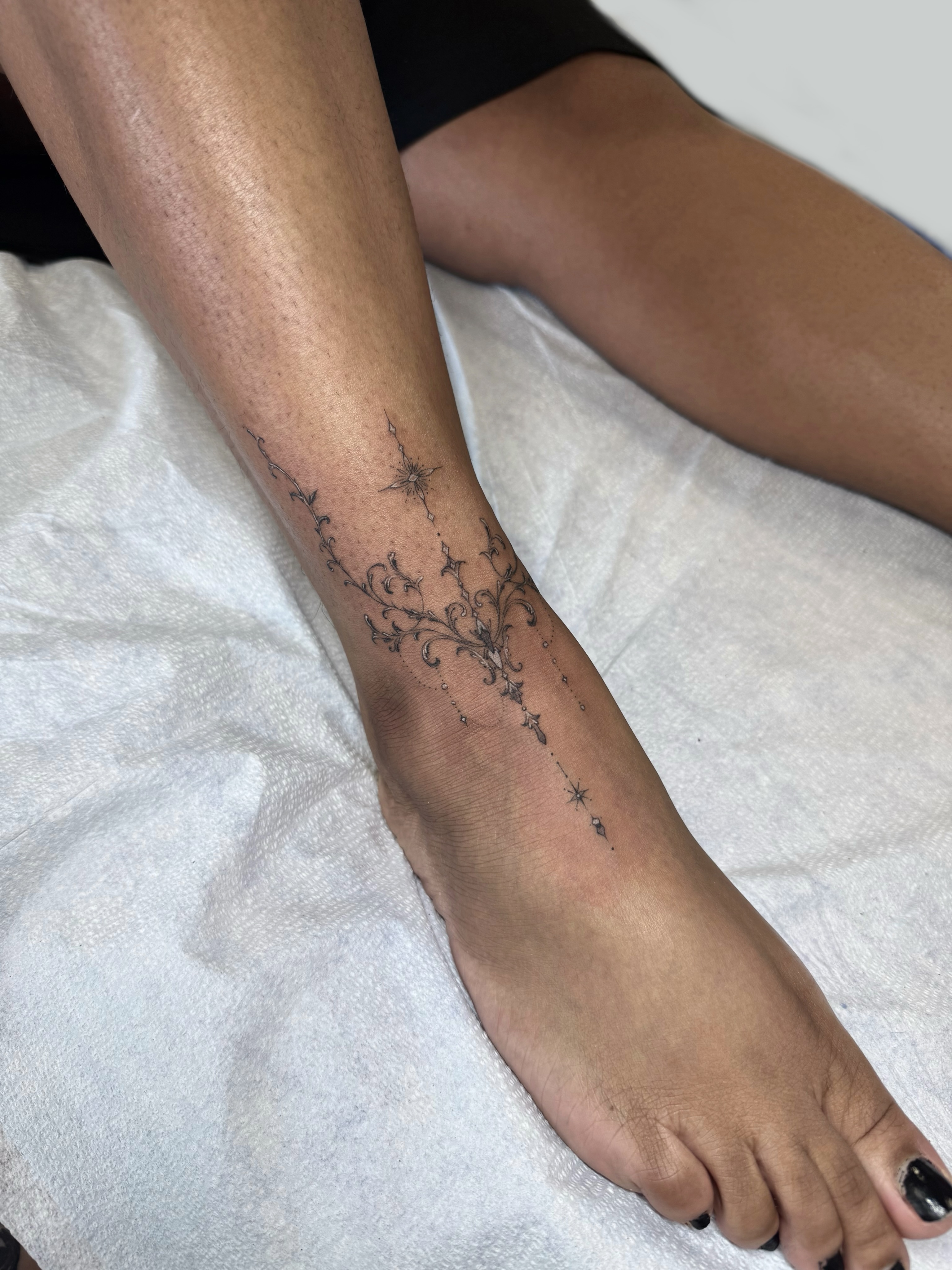 Floral vine black and grey tattoo on the foot by ๐๐๐๐๐๐
