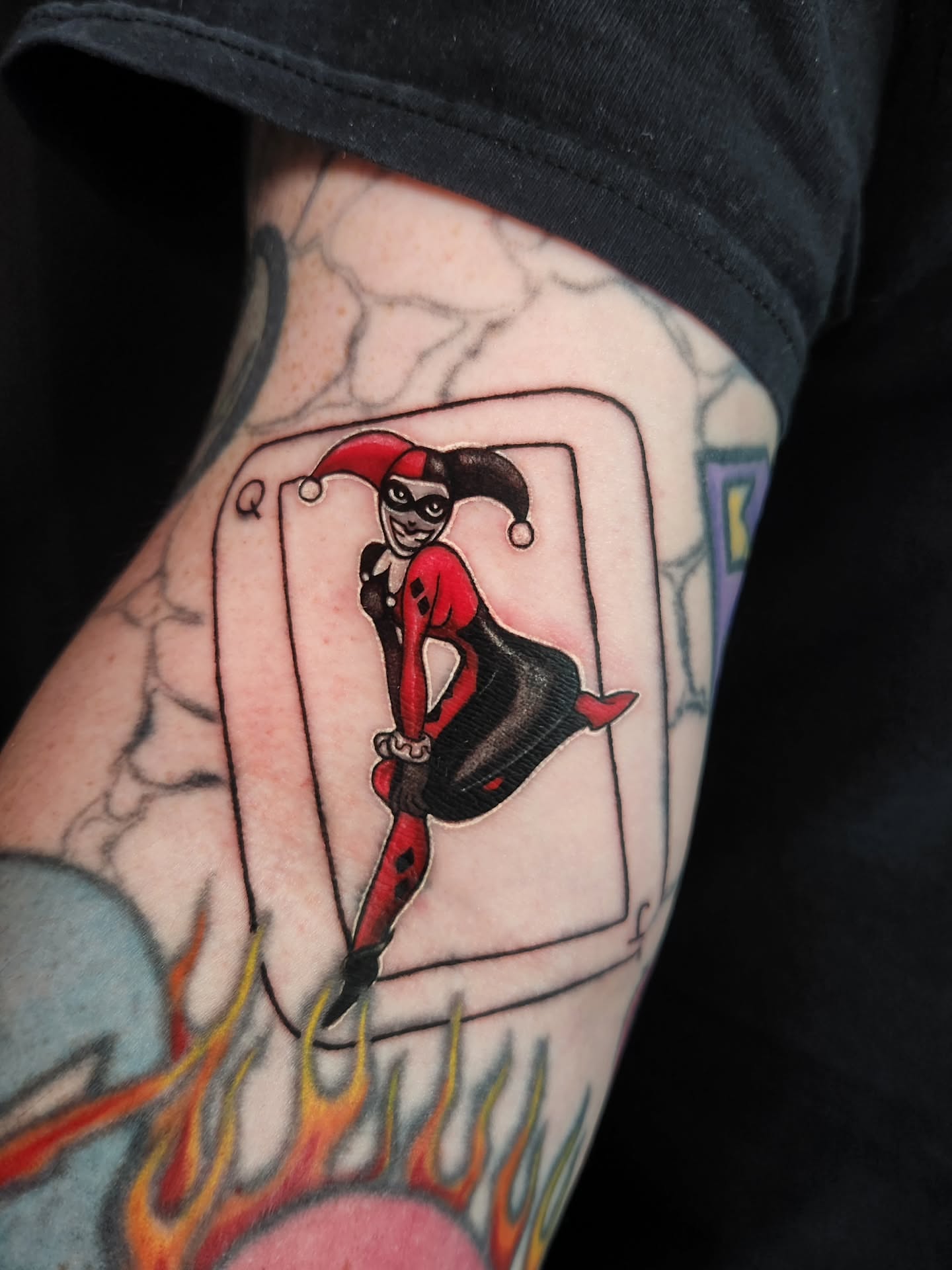 Harley Quinn American traditional tattoo on the forearm by Ashly Renee