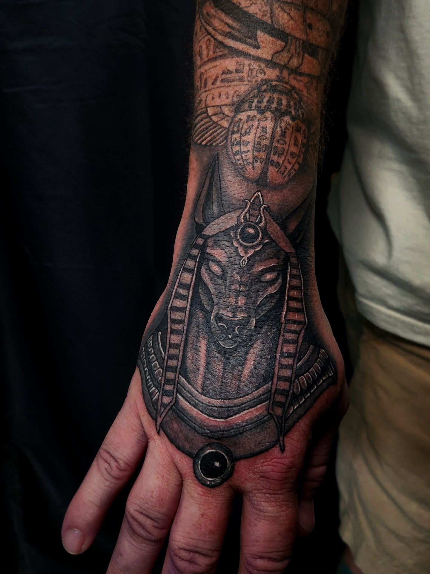 Ancient Egyptian deity realism tattoo on the hand by Ashly Renee