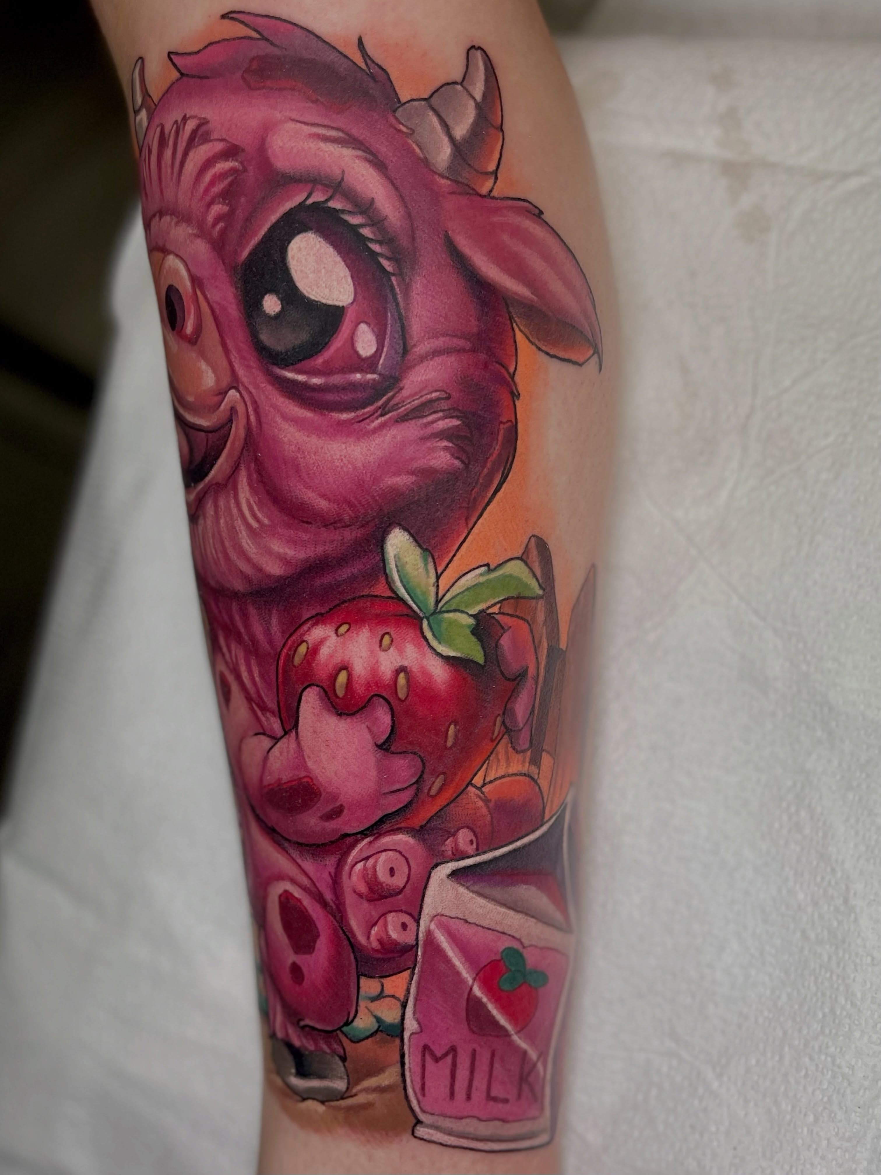 Strawberry monster realism tattoo on the forearm by Jacob Webb